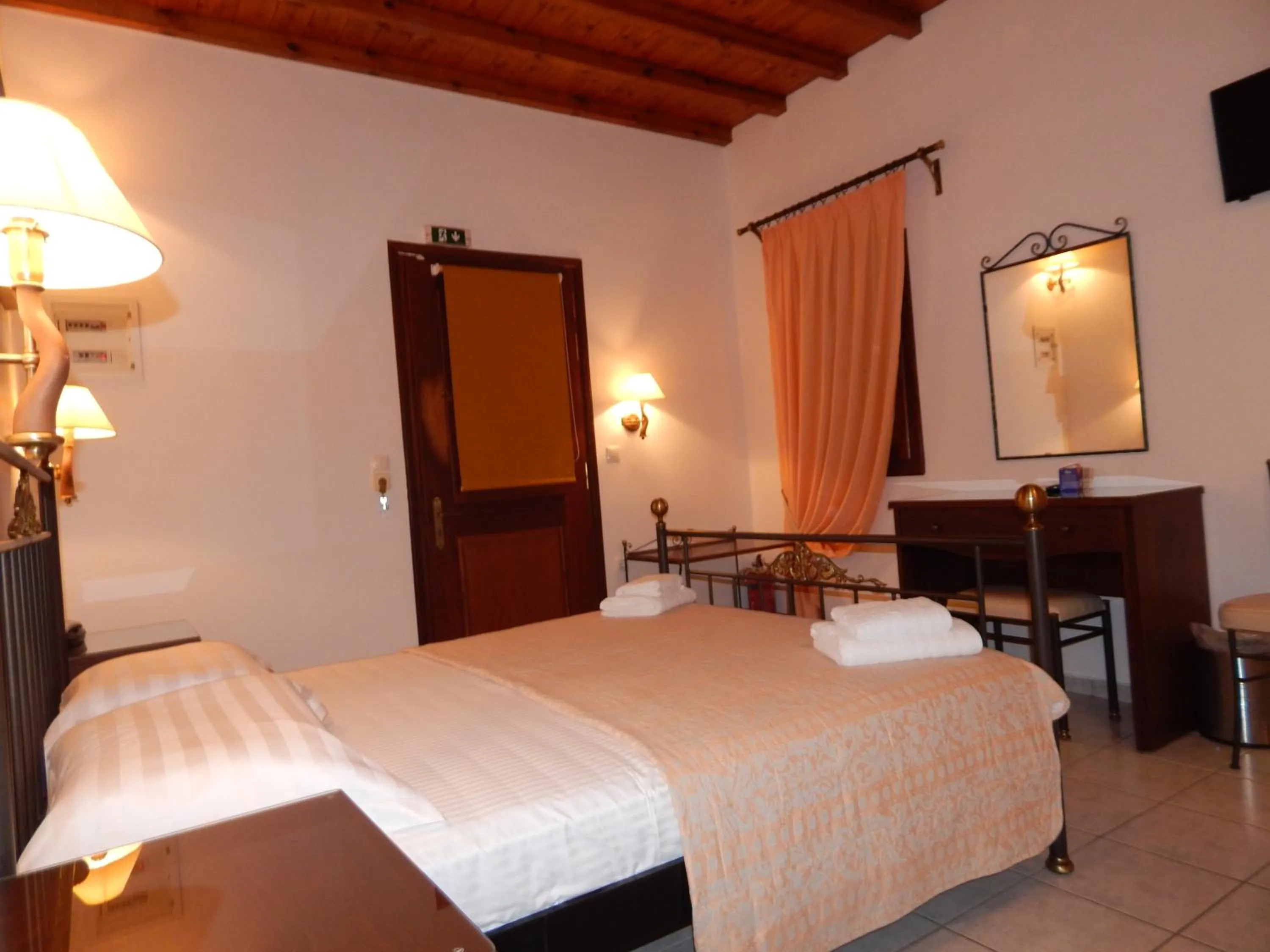 Bed in Tinos Suites & Apartments