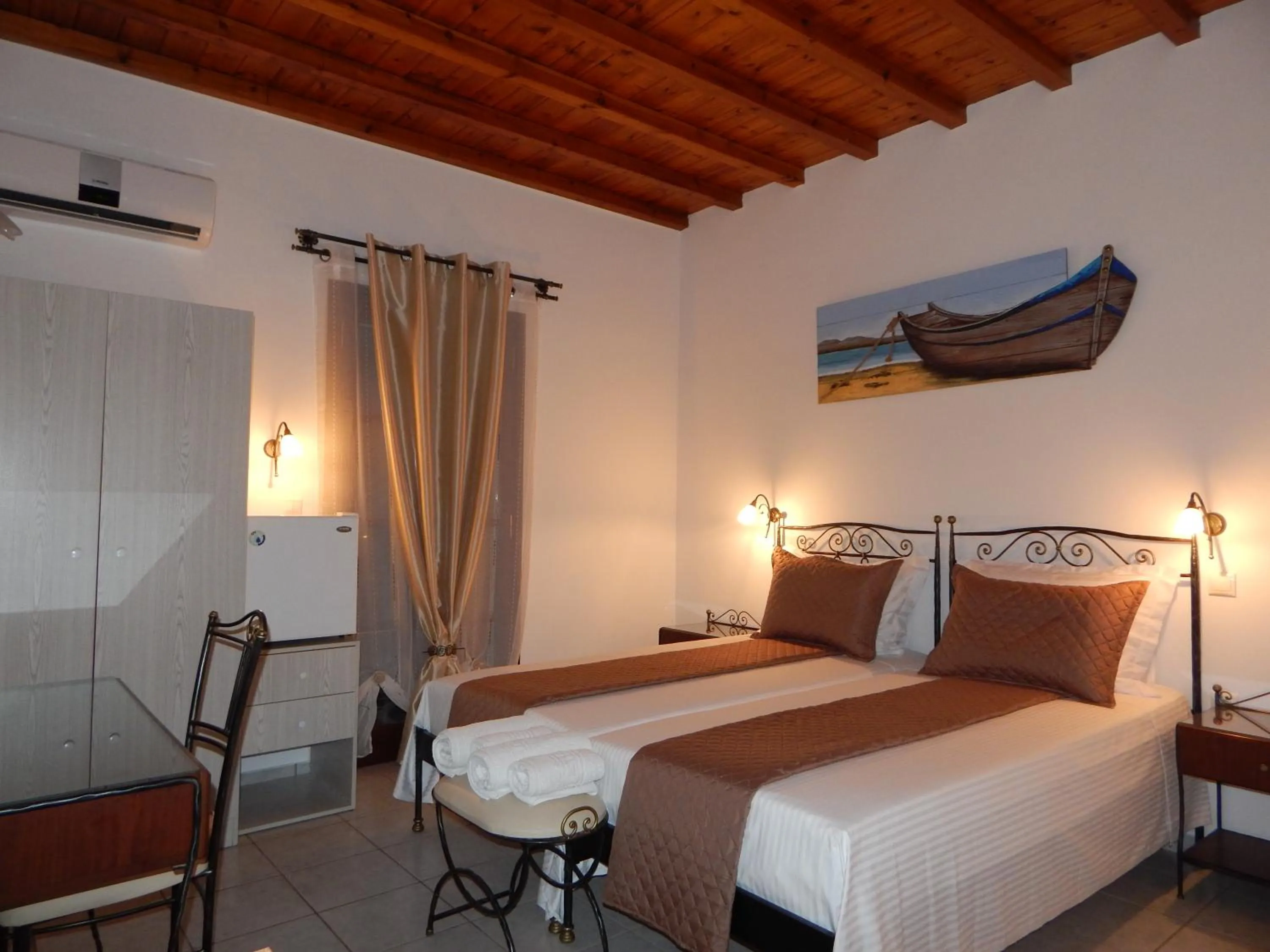 Bed in Tinos Suites & Apartments