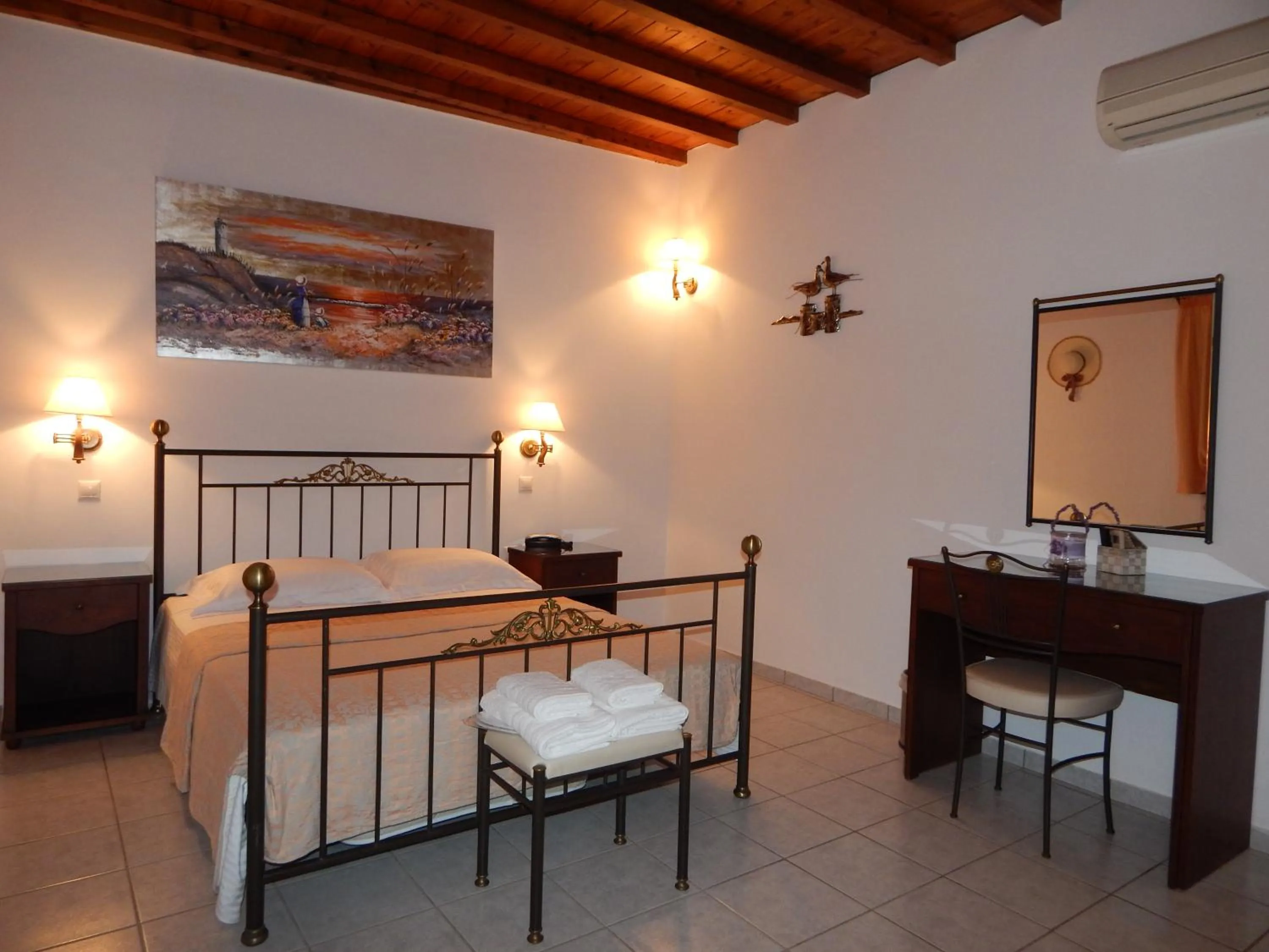 Bed in Tinos Suites & Apartments