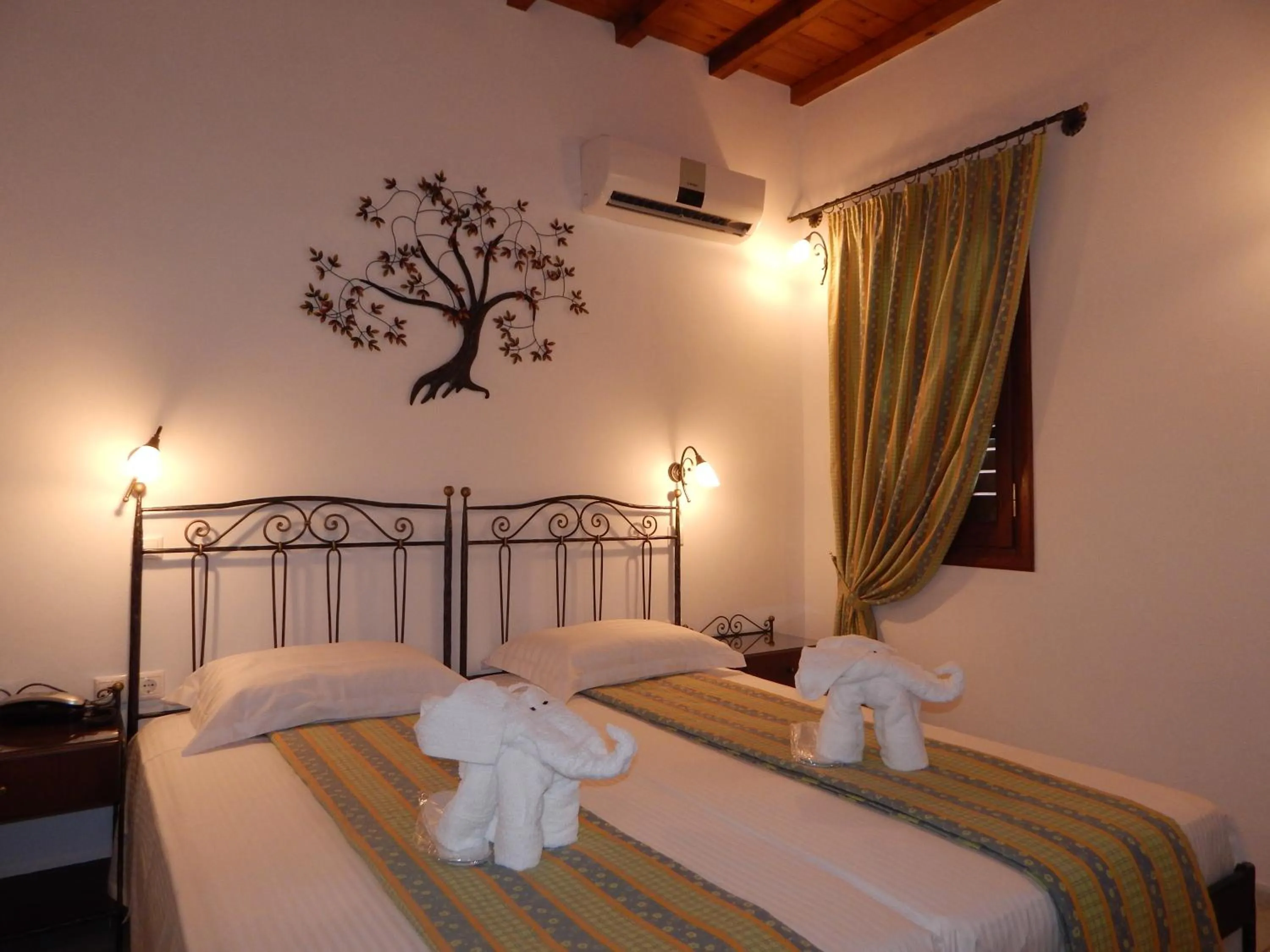 Bed in Tinos Suites & Apartments