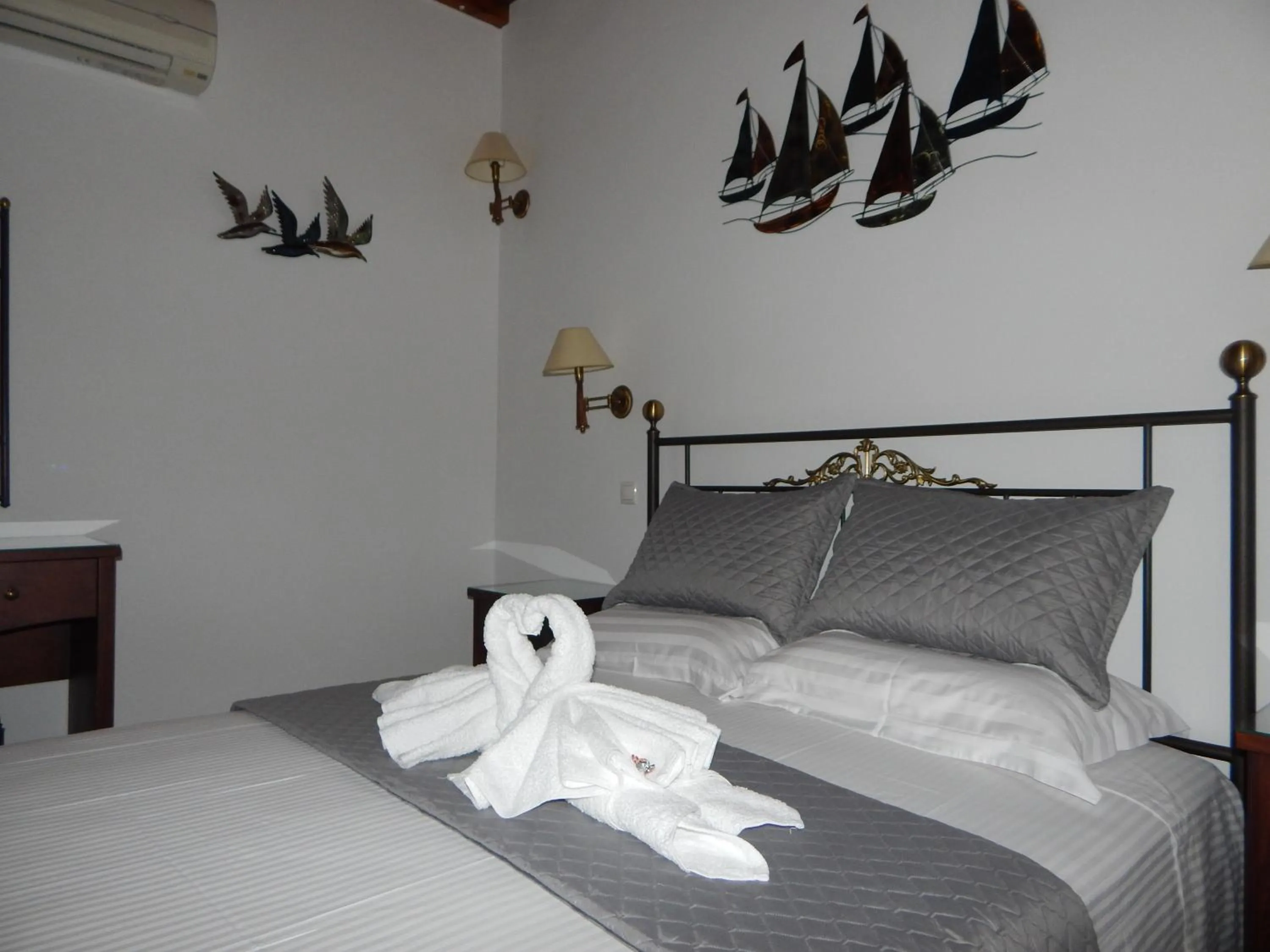 Bed in Tinos Suites & Apartments