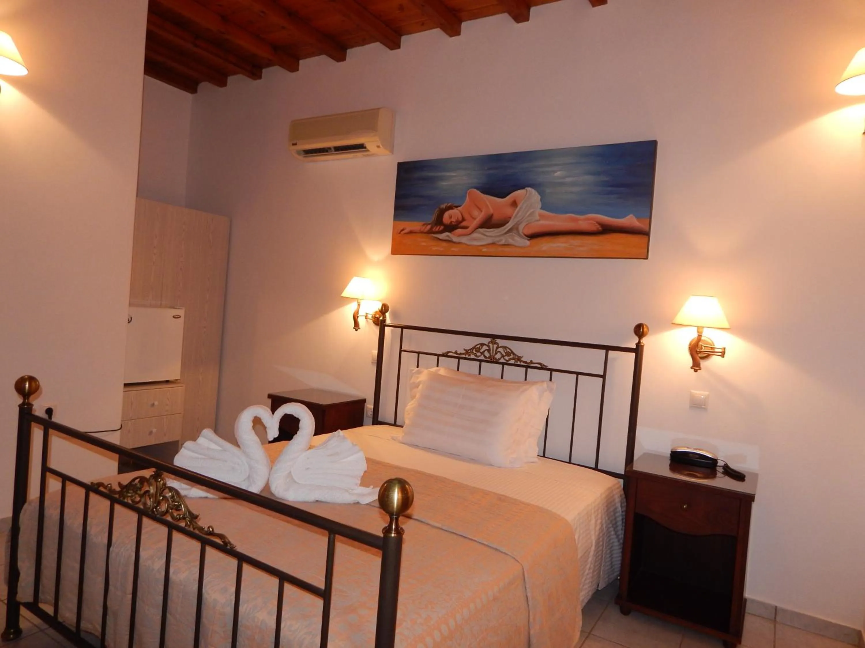 Bed in Tinos Suites & Apartments
