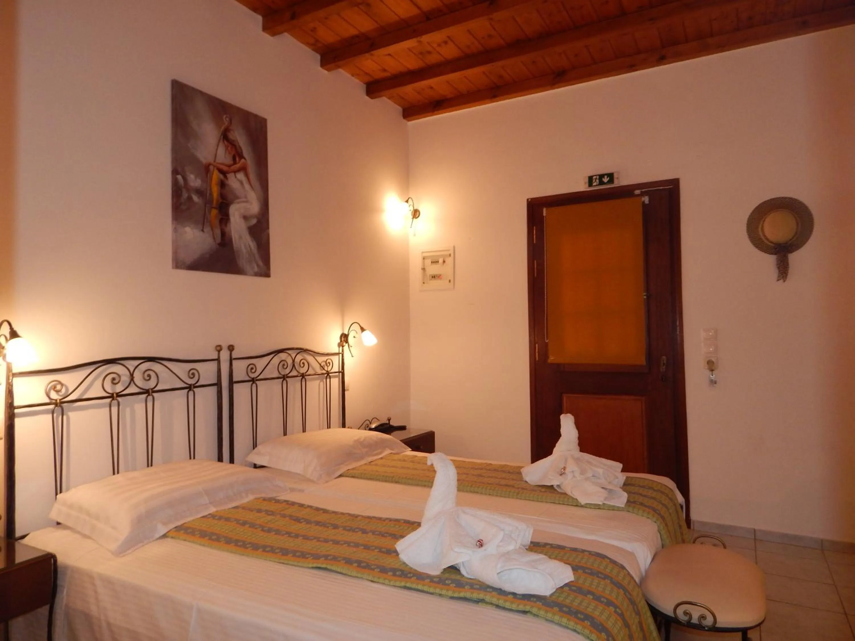 Bed in Tinos Suites & Apartments