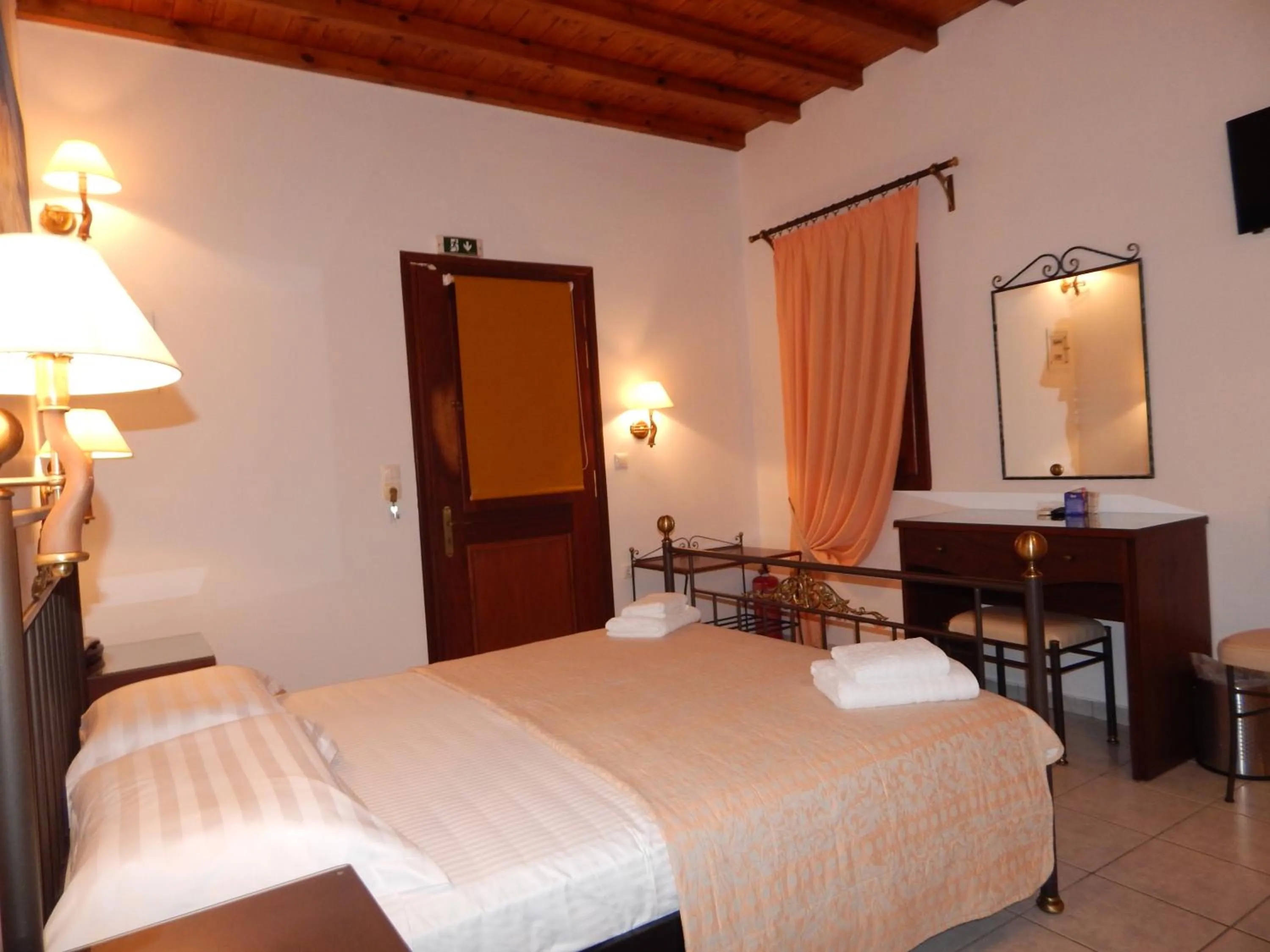 Bed in Tinos Suites & Apartments