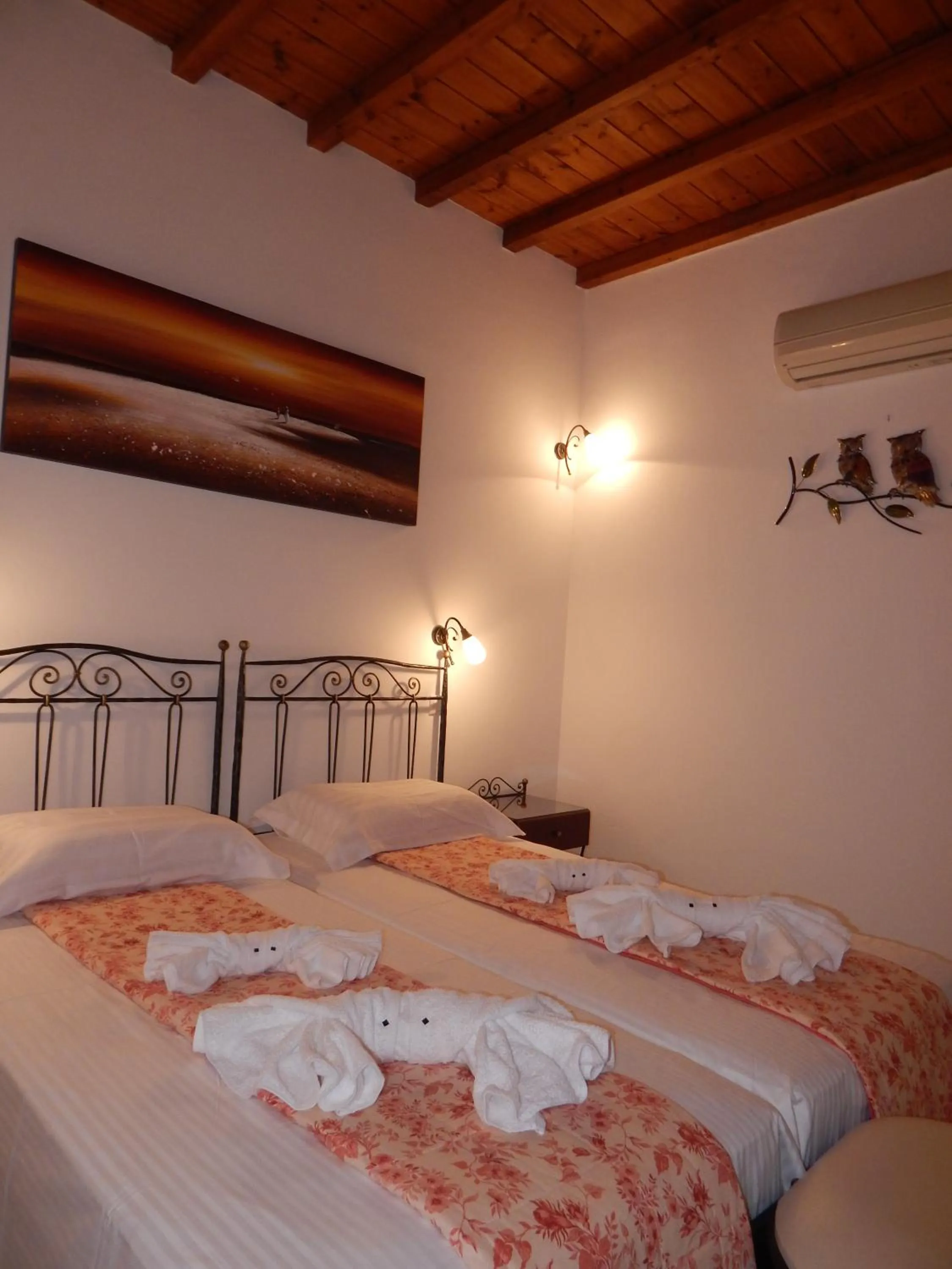 Bed in Tinos Suites & Apartments
