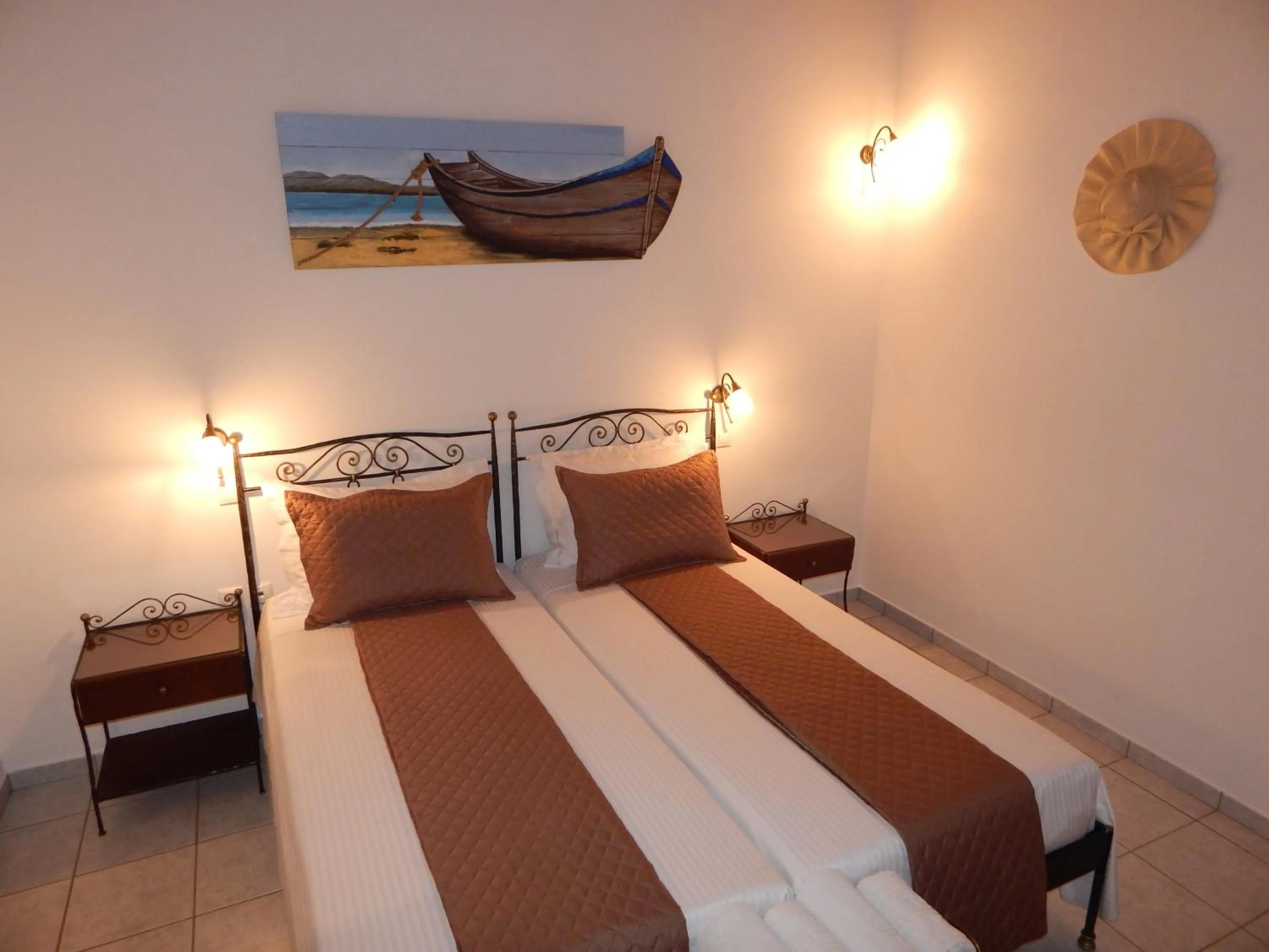 Bed in Tinos Suites & Apartments