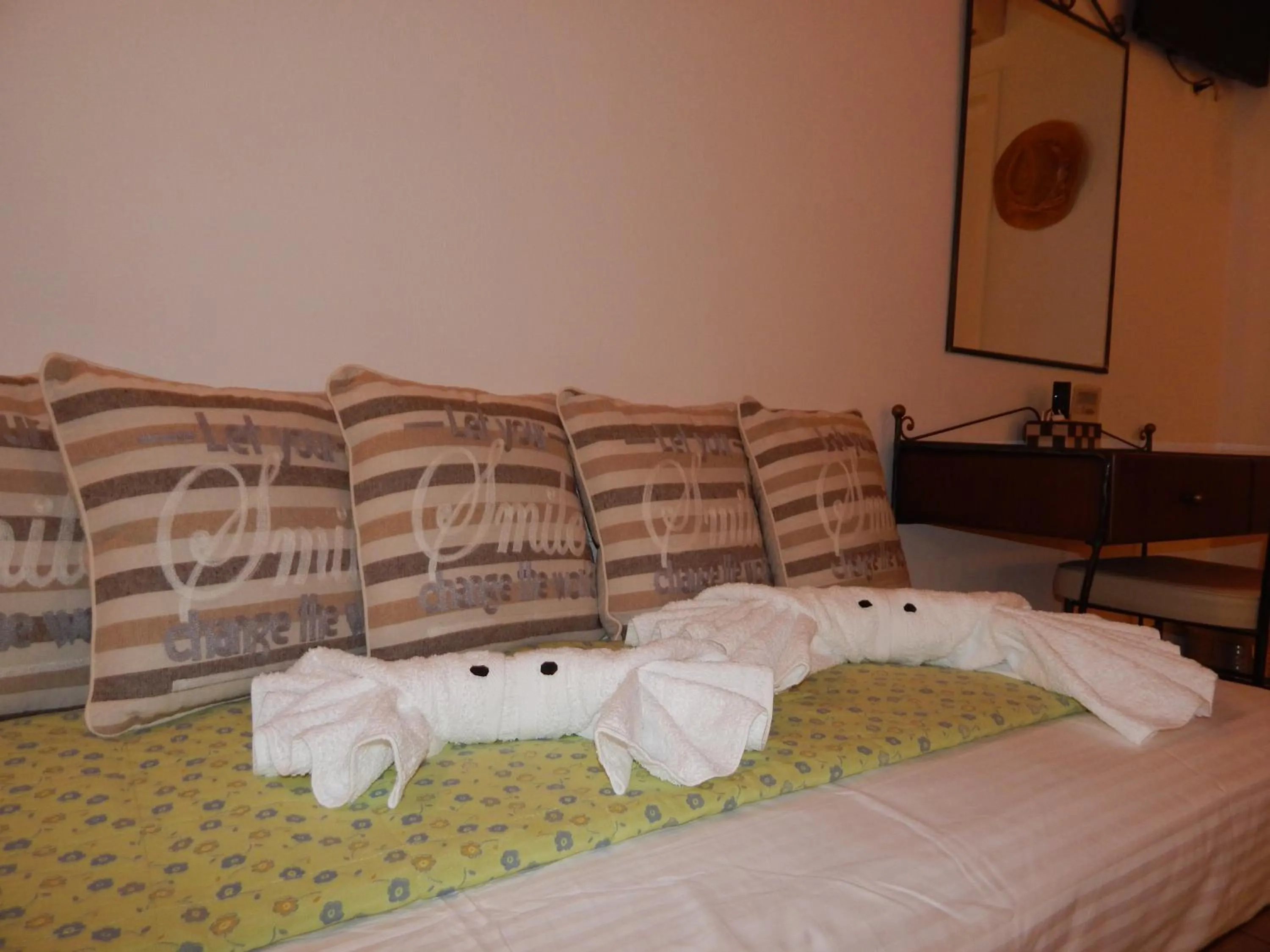 Bed in Tinos Suites & Apartments