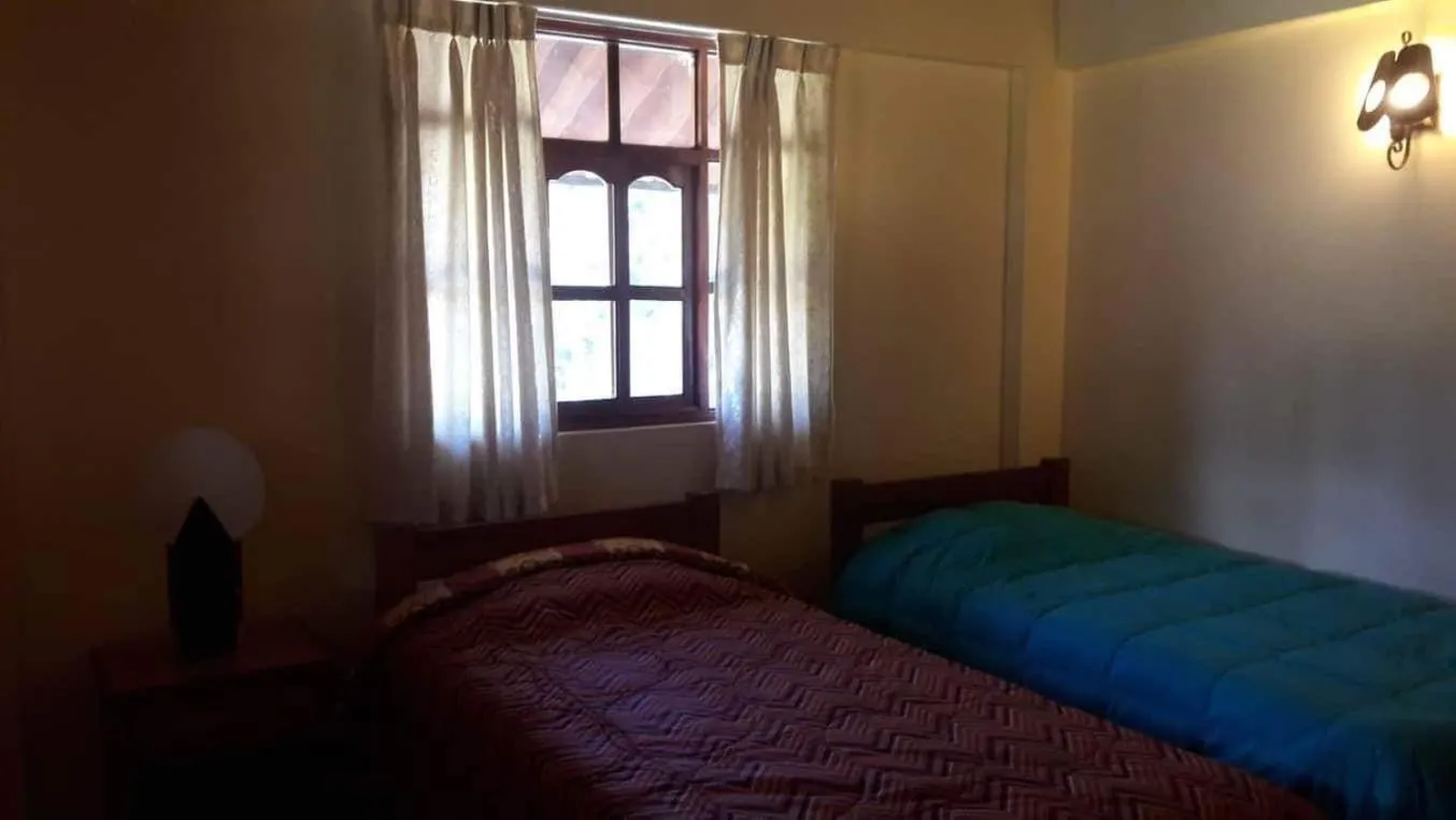 Bed in Lodge Acopampa Inn