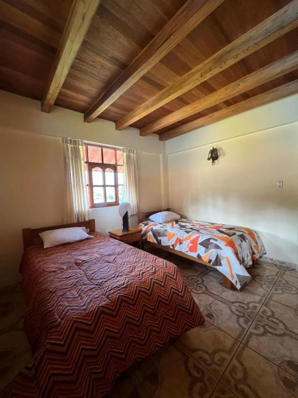 Bed in Lodge Acopampa Inn