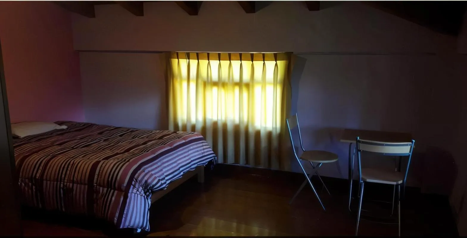 Bed in Lodge Acopampa Inn