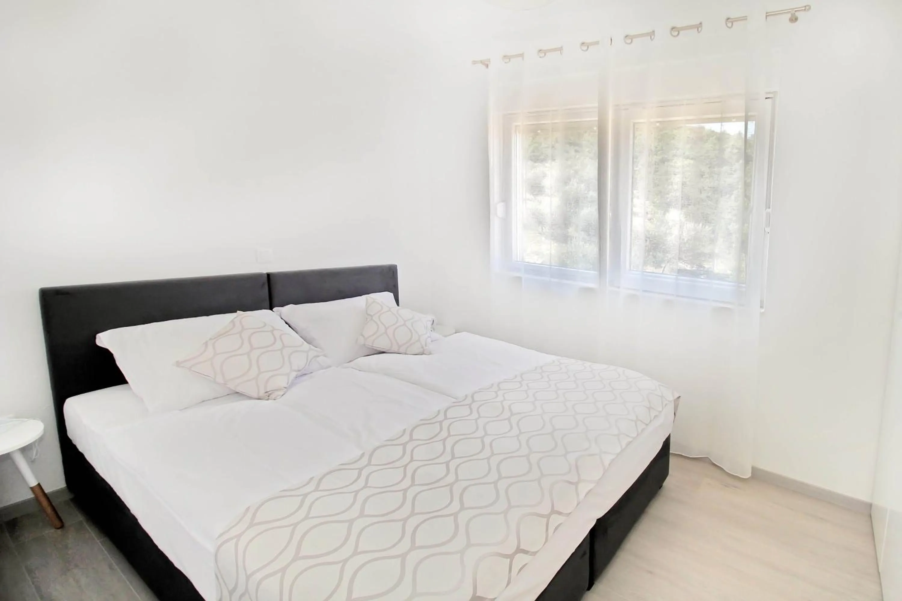 Bed in Bacan Family Apartments