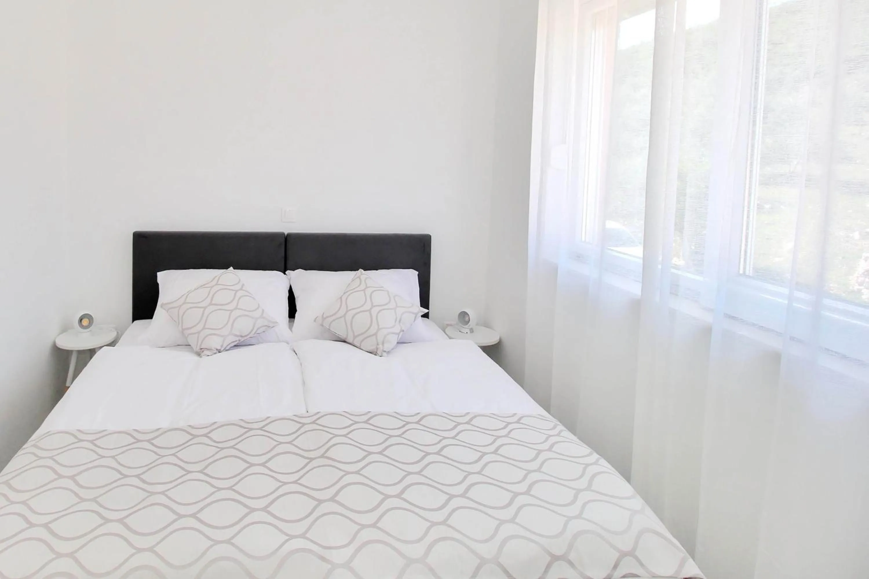 Bed in Bacan Family Apartments