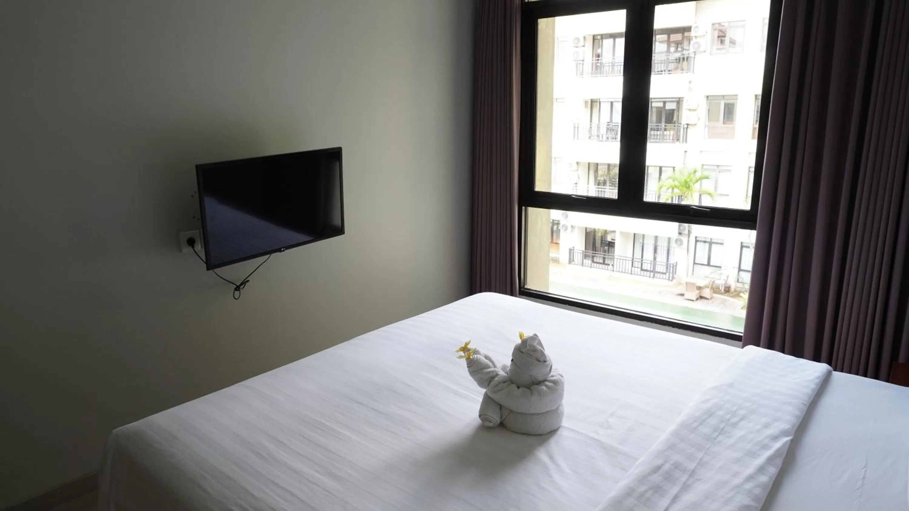 Property building, Bed in Grand Kuta Hotel and Residence