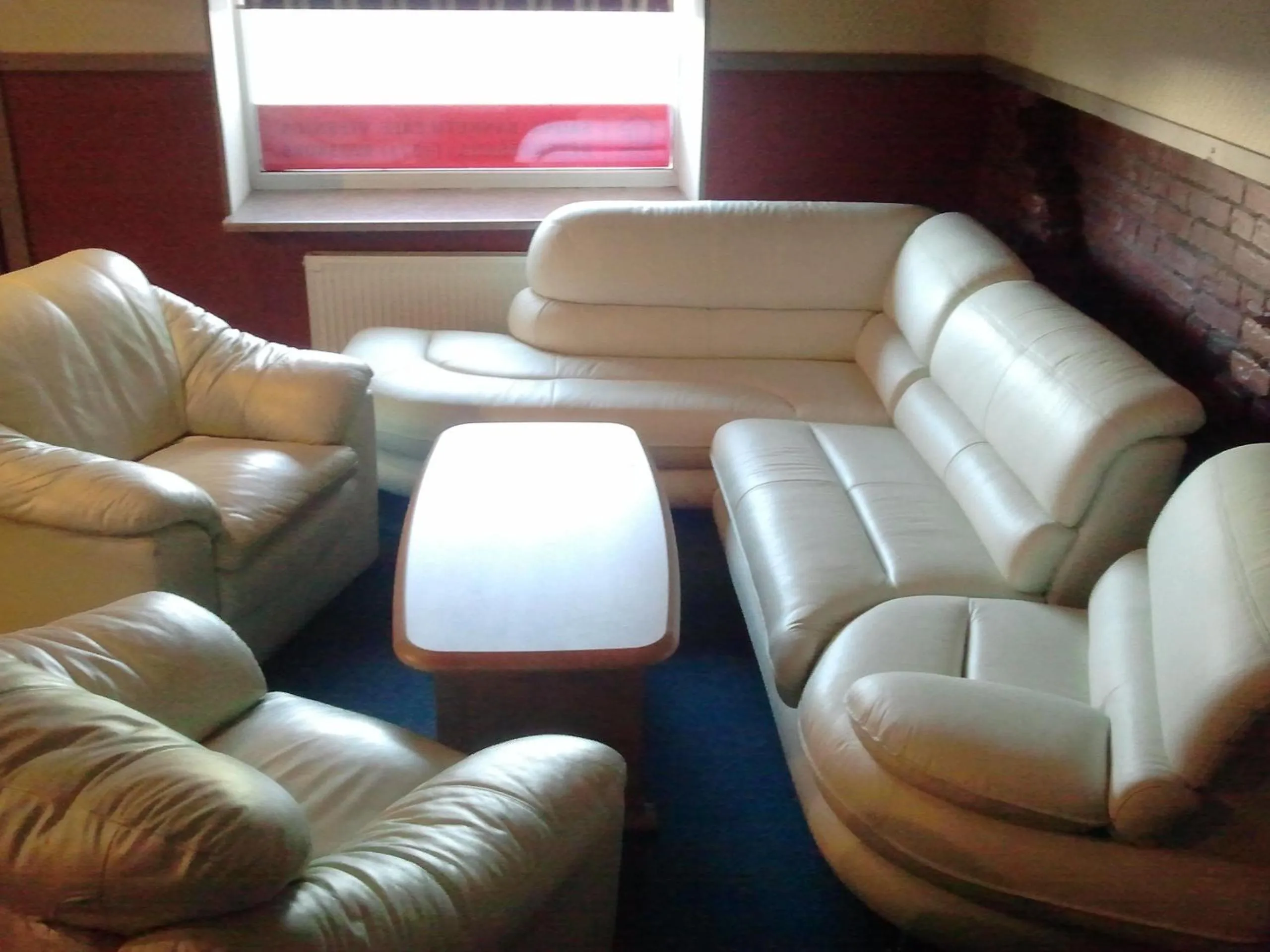 Communal lounge/ TV room in Hotel Erfolg