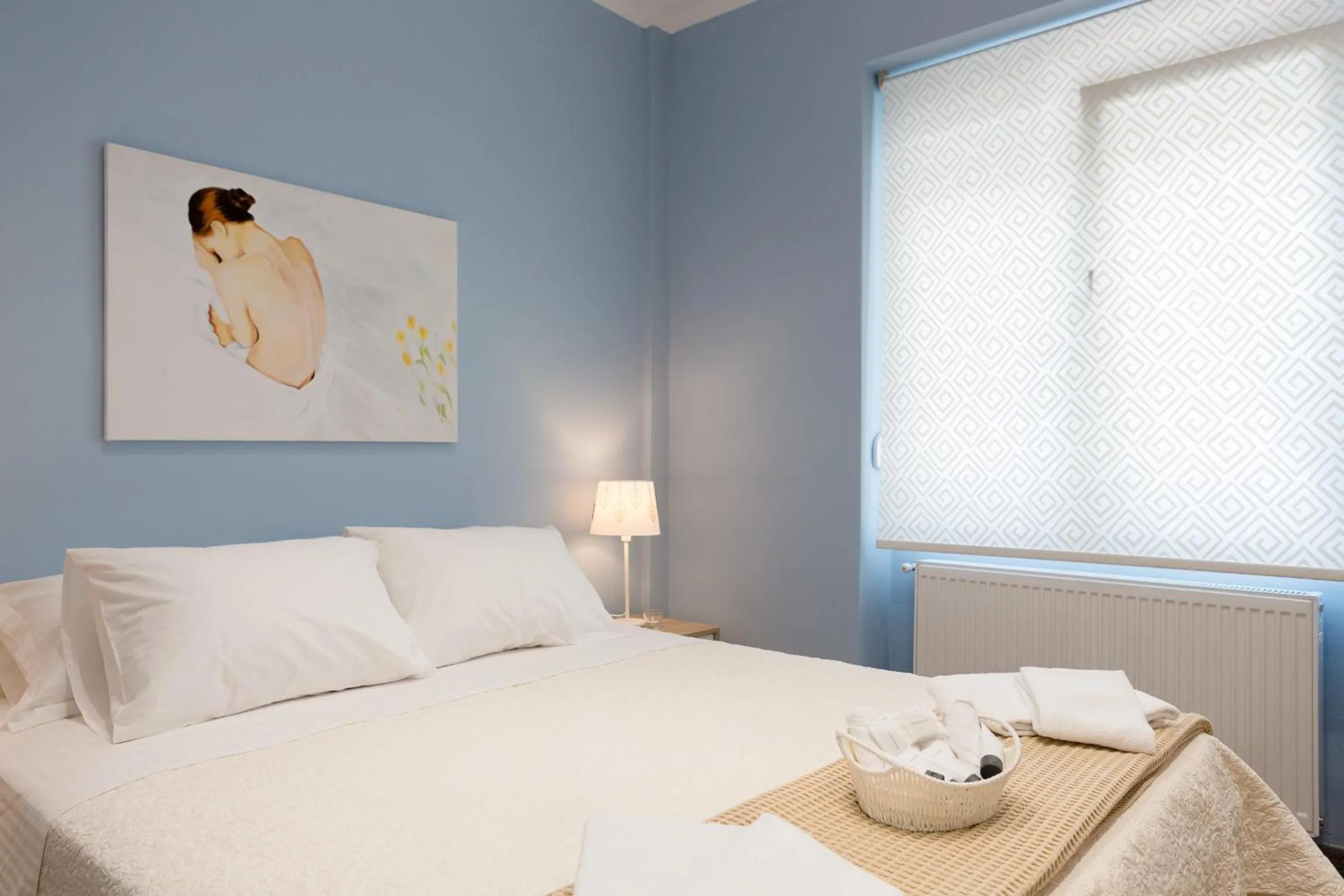Bed in Grandma's Chic & Bright Athenian home with a Patio