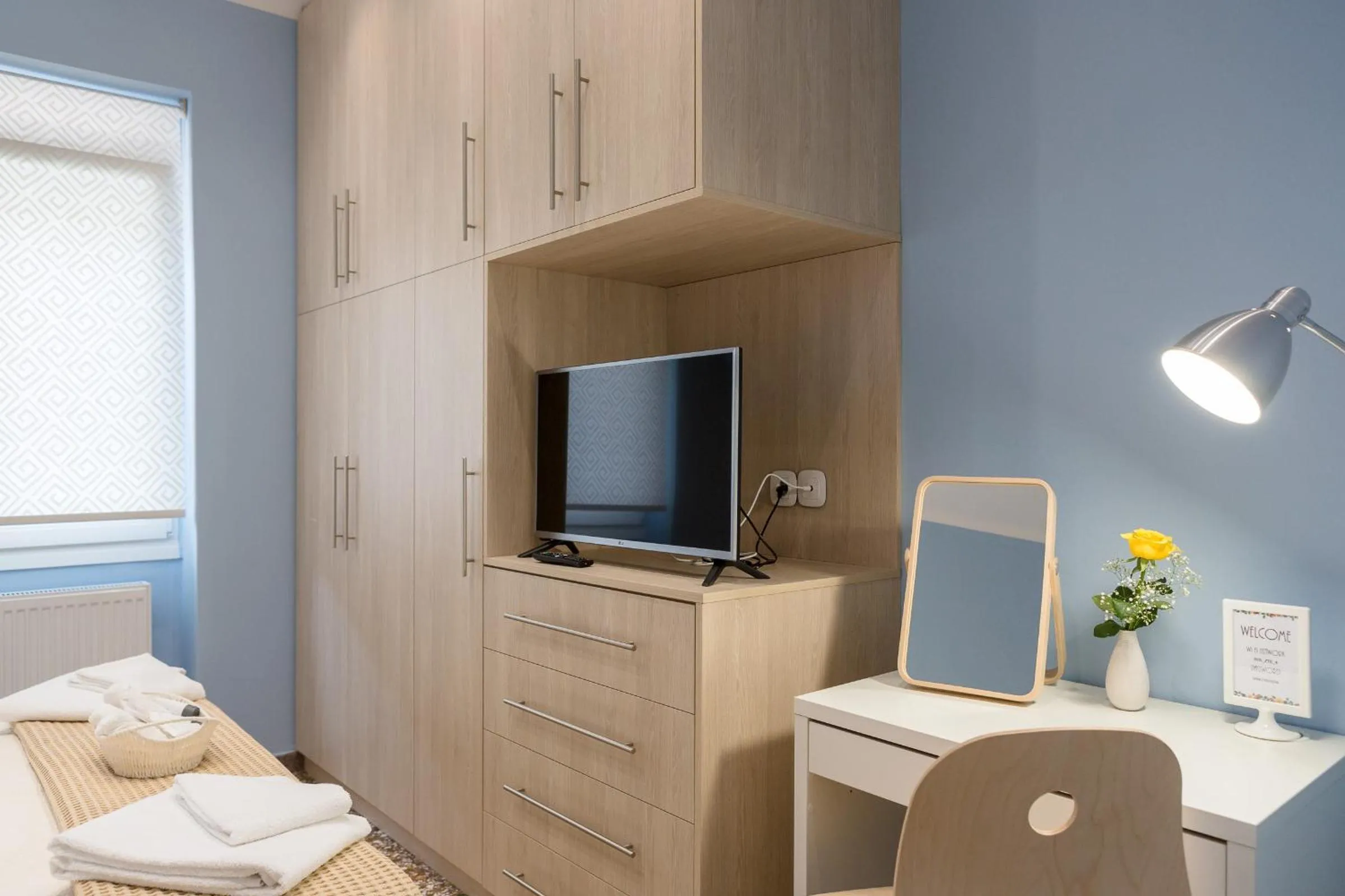 Bed in Grandma's Chic & Bright Athenian home with a Patio