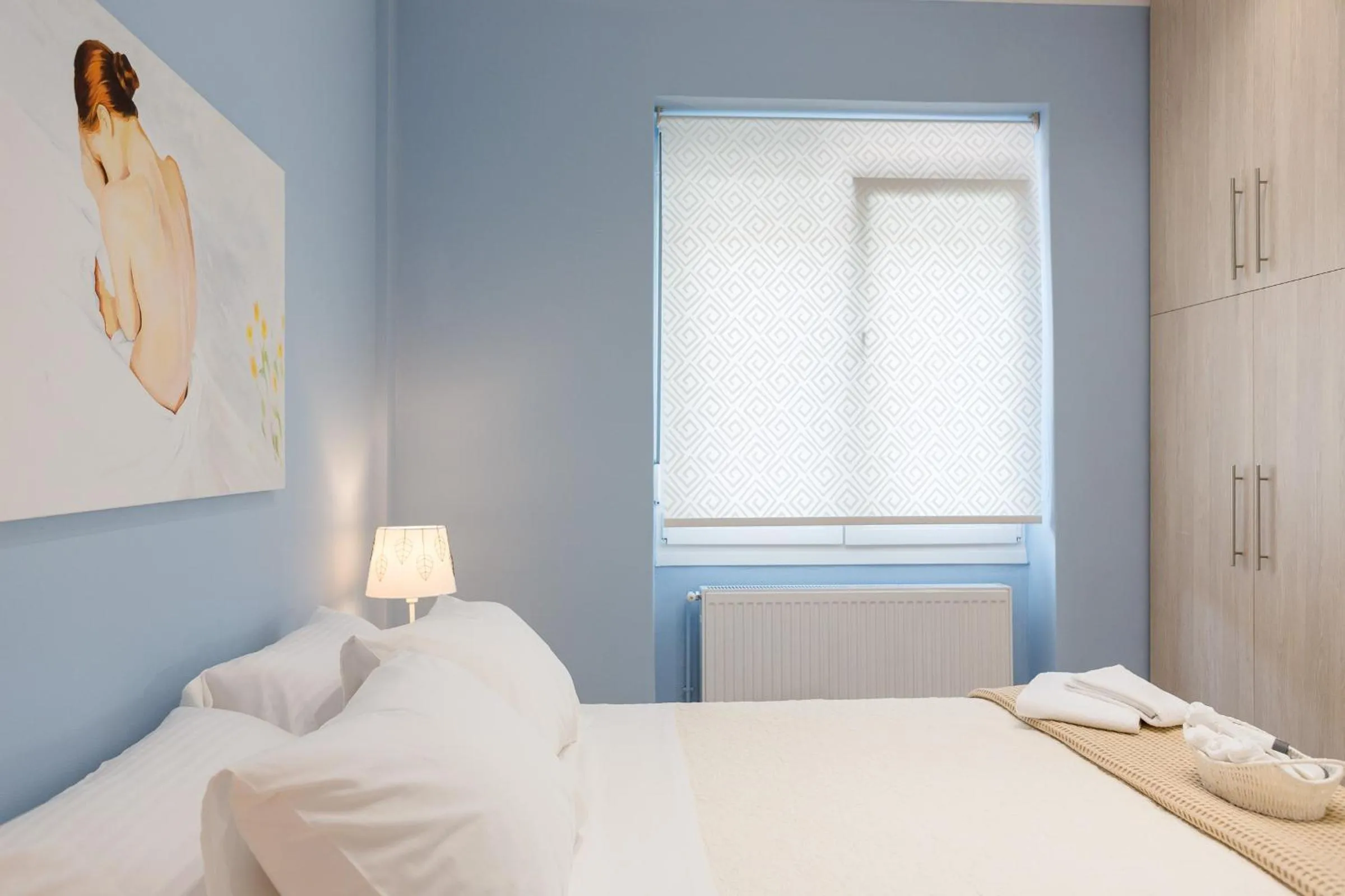 Bed in Grandma's Chic & Bright Athenian home with a Patio
