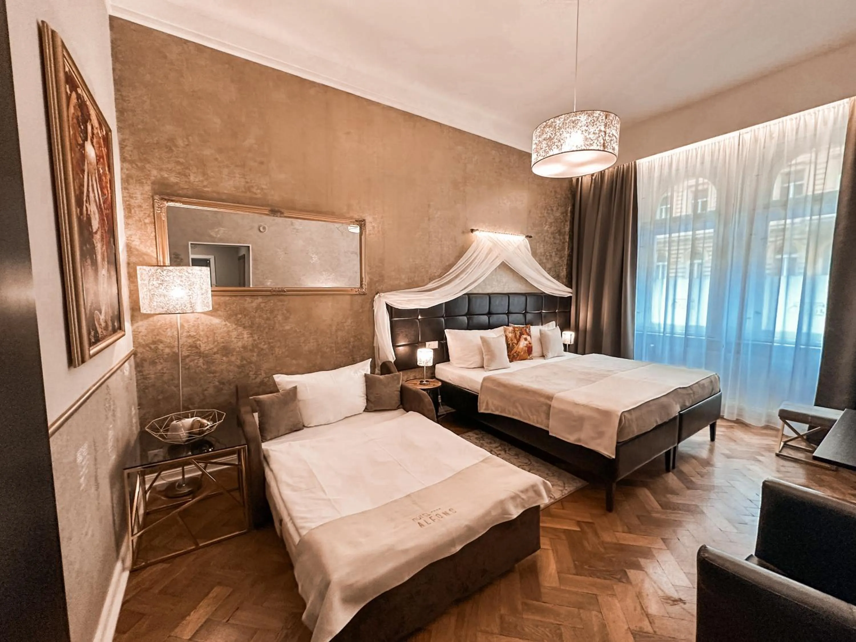 Bed in Alfons Boutique Hotel