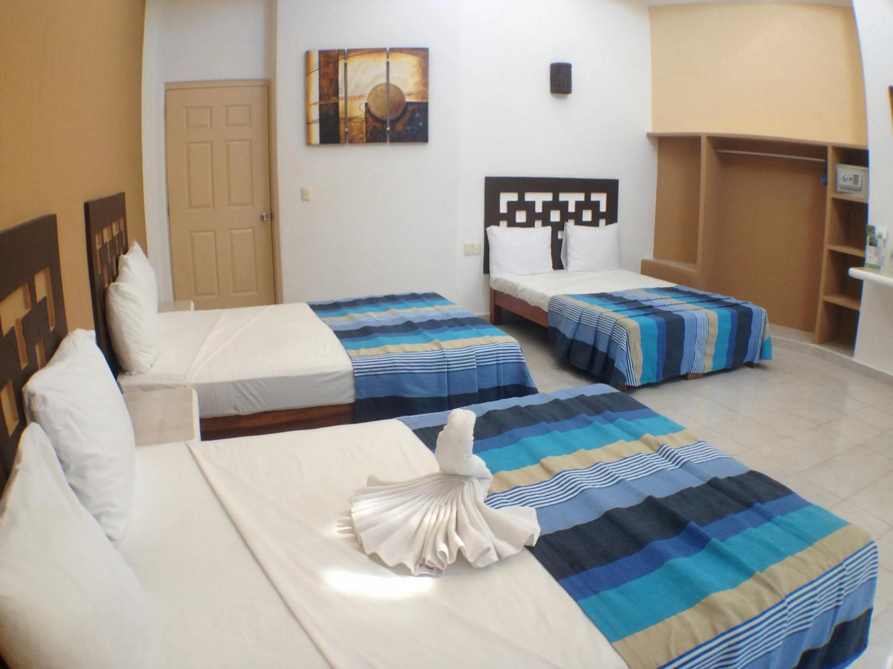 Bed in Hotel Bahia Huatulco