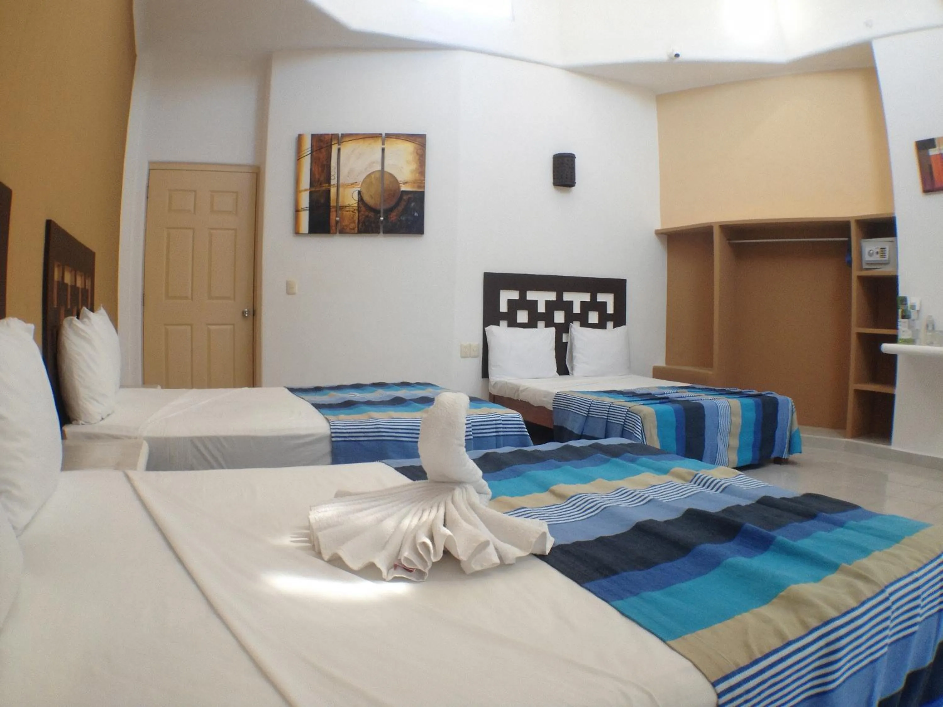 Bed in Hotel Bahia Huatulco