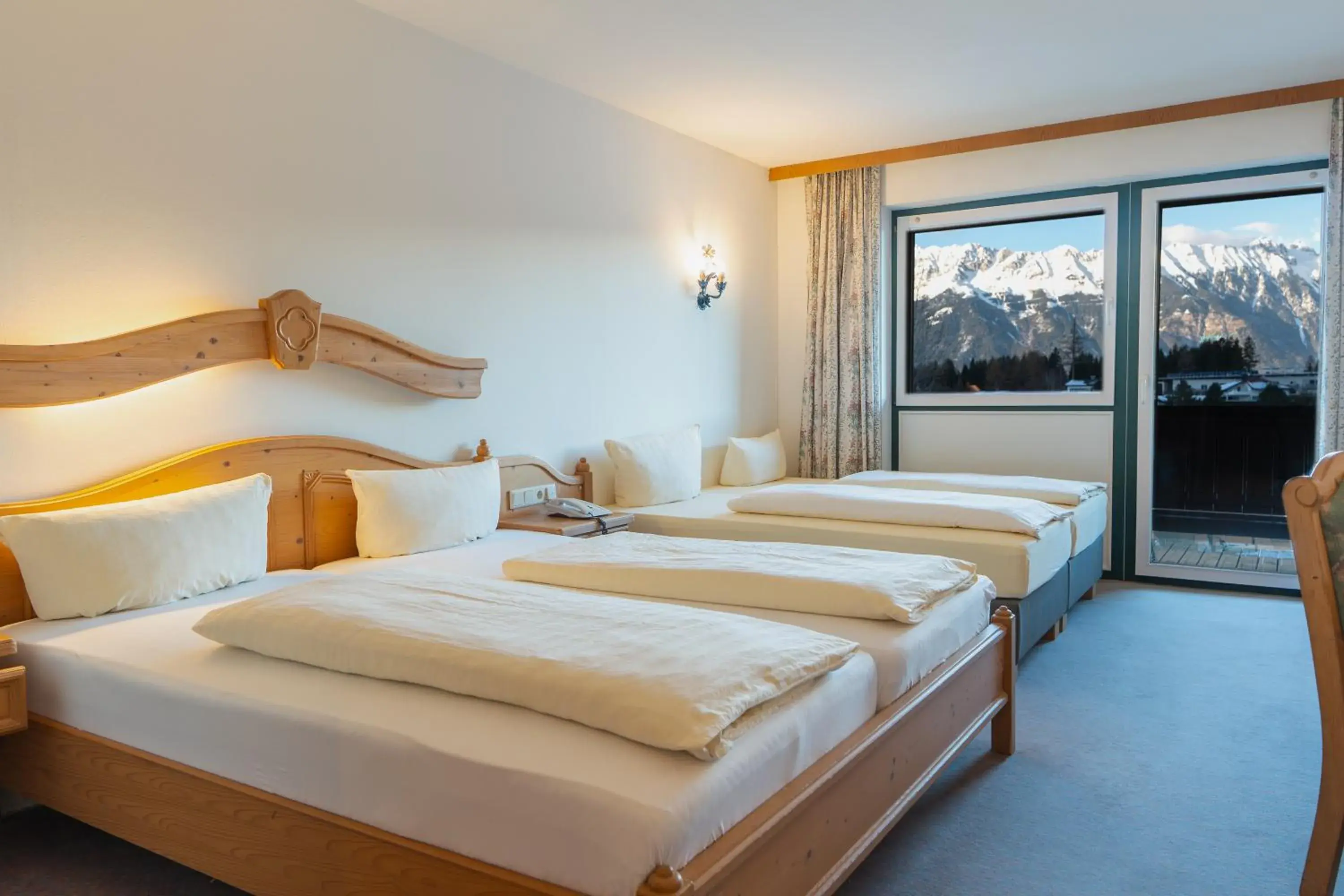 Photo of the whole room, Bed in Hotel Gruberhof Innsbruck Igls B&B Photo of the whole room, Bed in Hotel Gruberhof Innsbruck Igls B&B