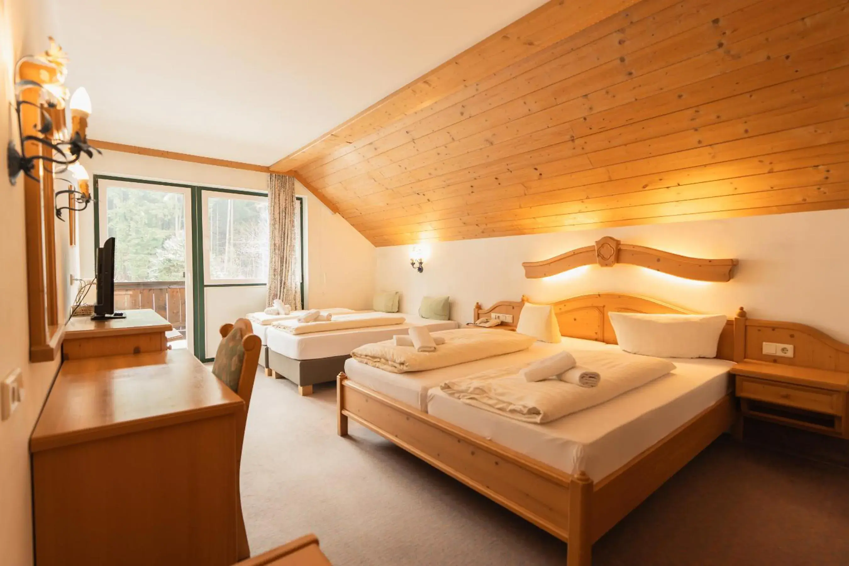 Photo of the whole room, Bed in Hotel Gruberhof Innsbruck Igls B&B Photo of the whole room, Bed in Hotel Gruberhof Innsbruck Igls B&B