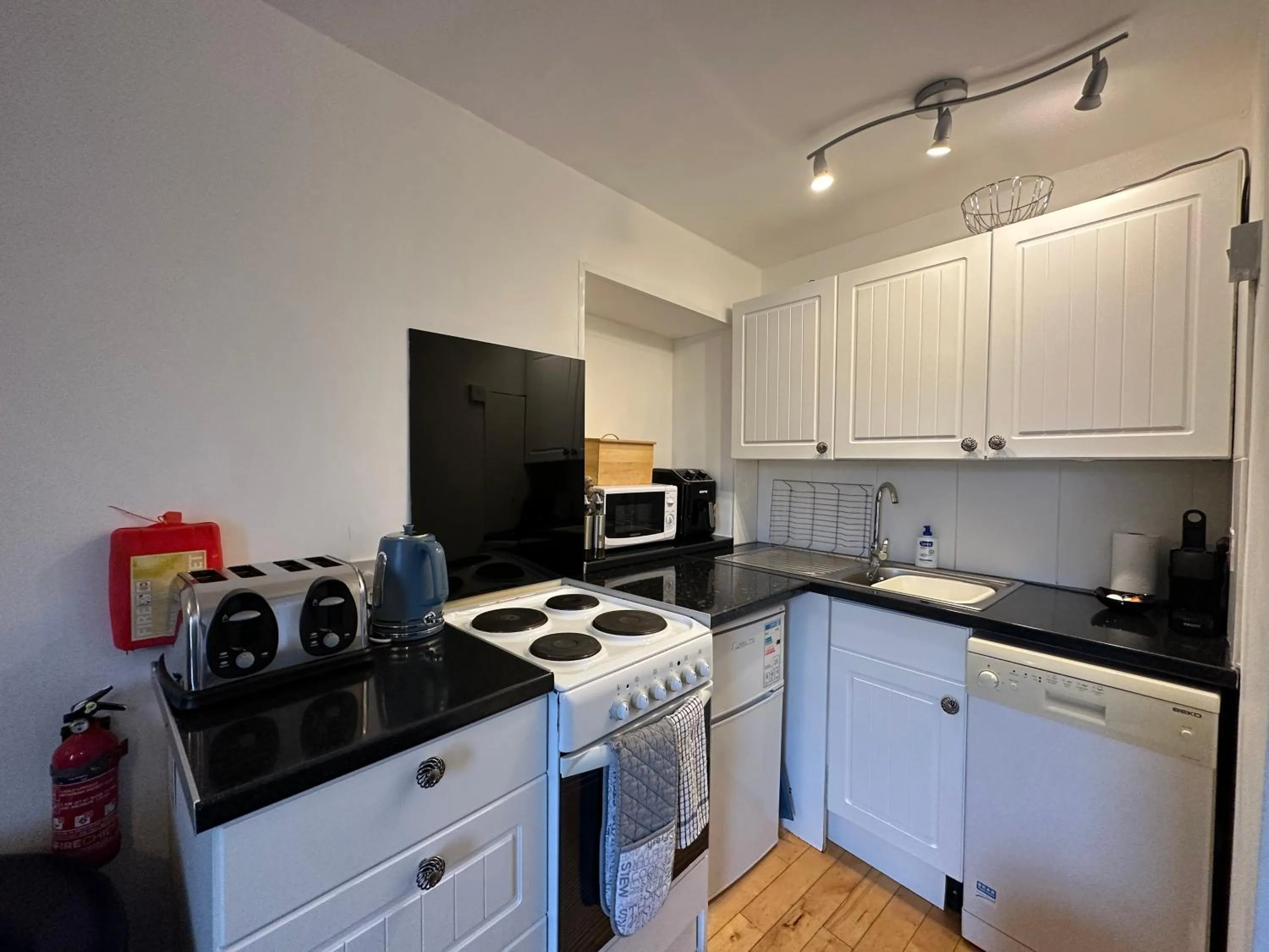 Kitchen or kitchenette in The Carlton's Holiday Suites