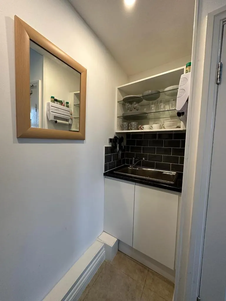 Kitchen or kitchenette in The Carlton's Holiday Suites