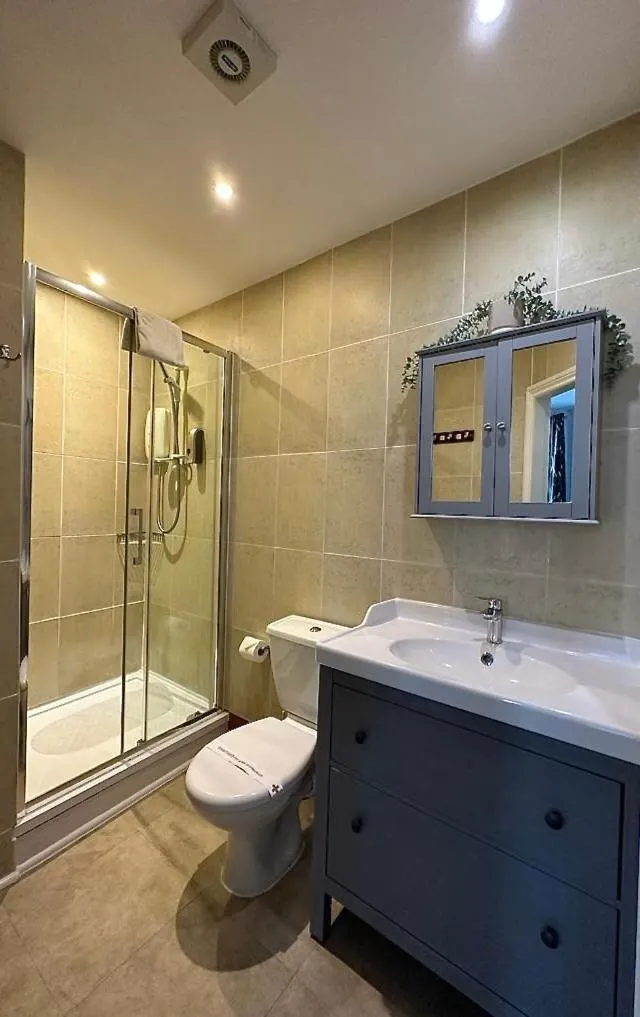 Shower in The Carlton's Holiday Suites