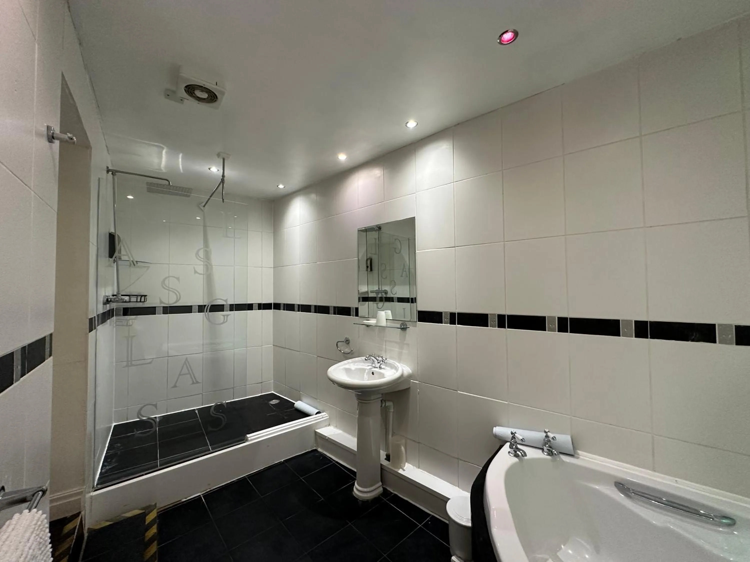 Shower in The Carlton's Holiday Suites