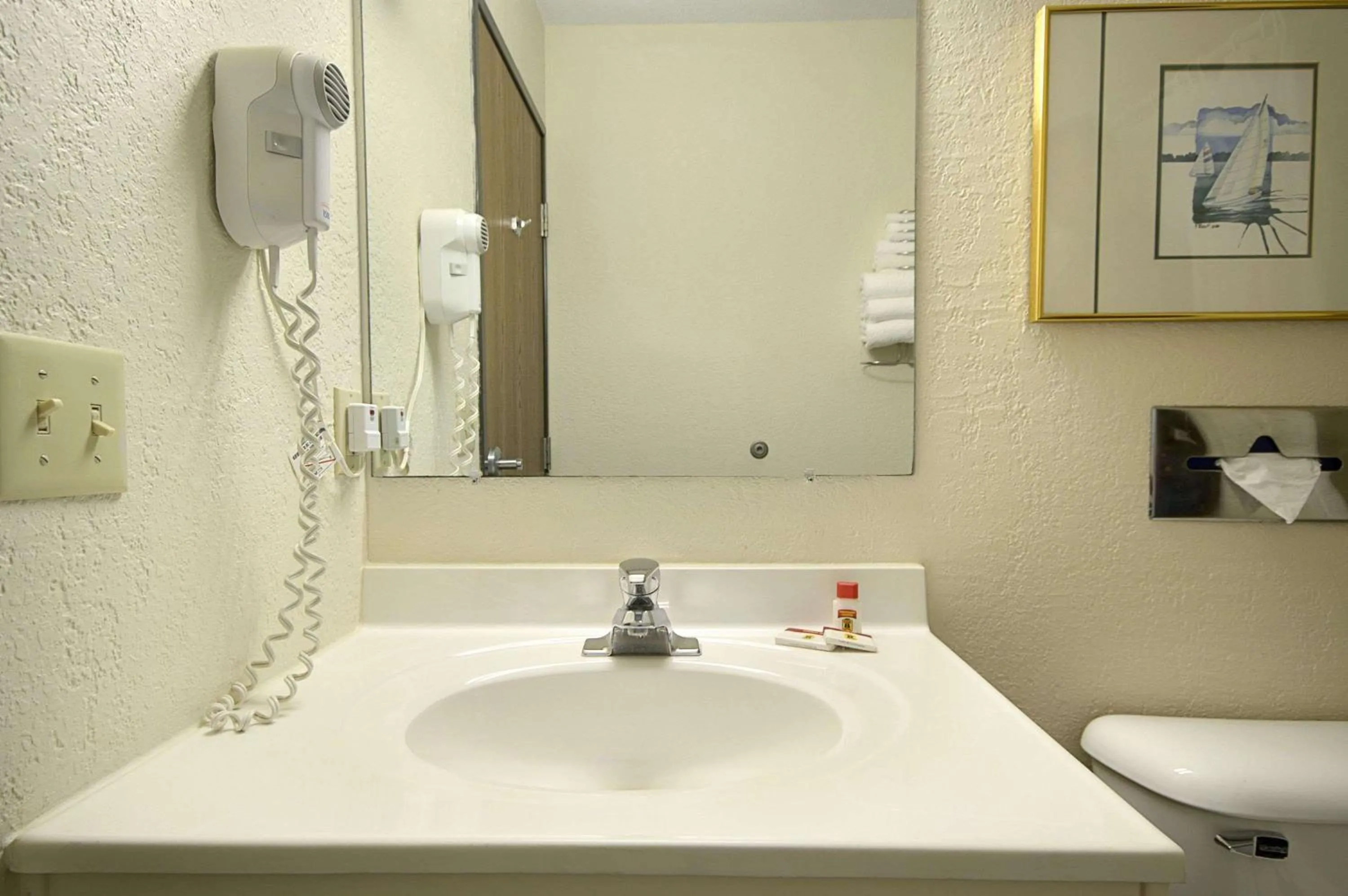 Bathroom in Travelodge by Wyndham Hudsonville