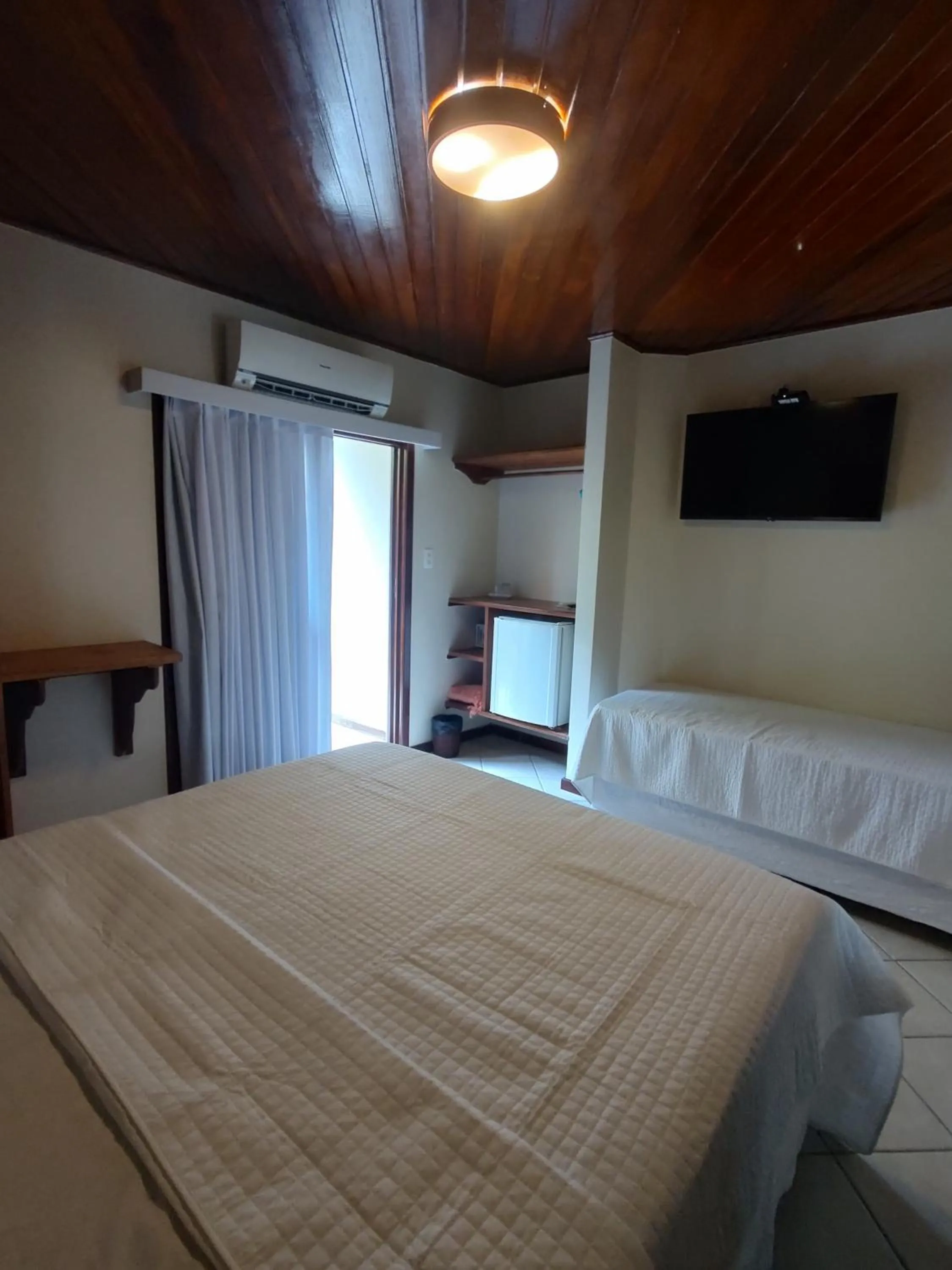 Photo of the whole room, Bed in Pousada Caiçara