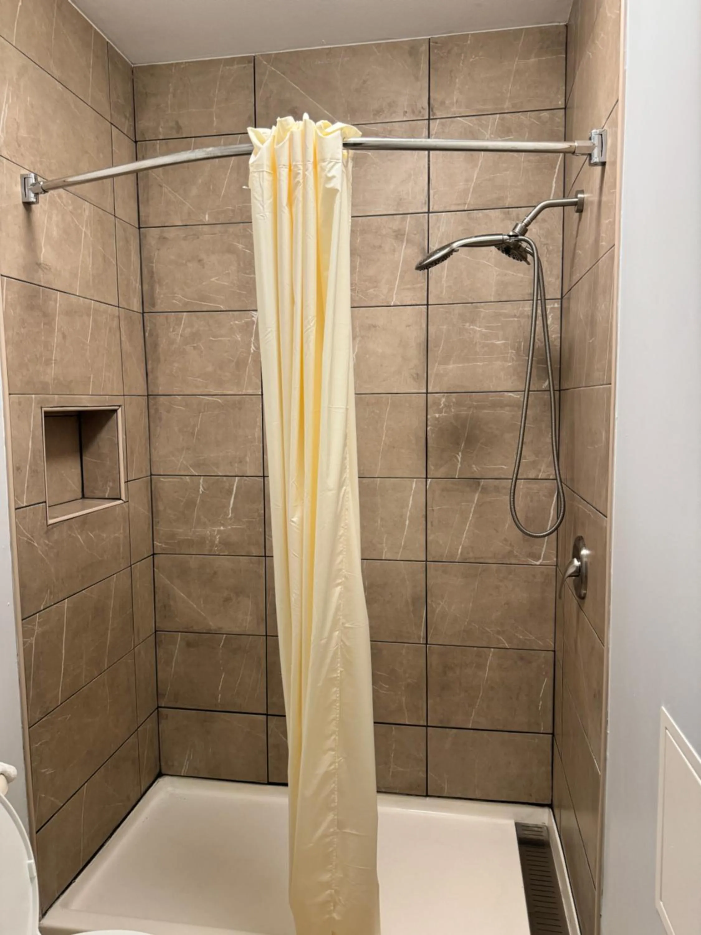 Shower in Texas Inn and Suites City Center at University Dr.