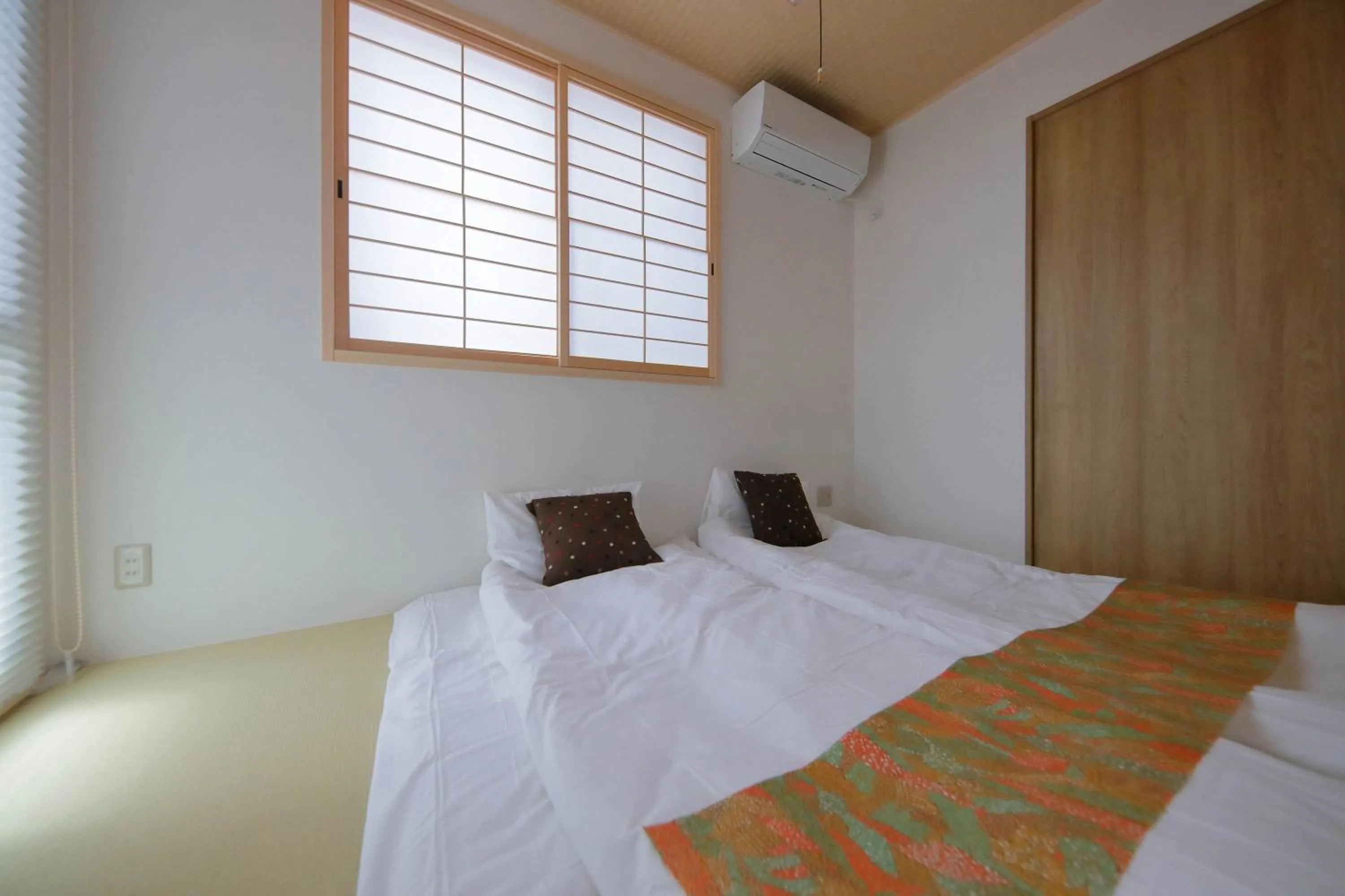 Bed in Kyo Machiya Ryokan Yuan