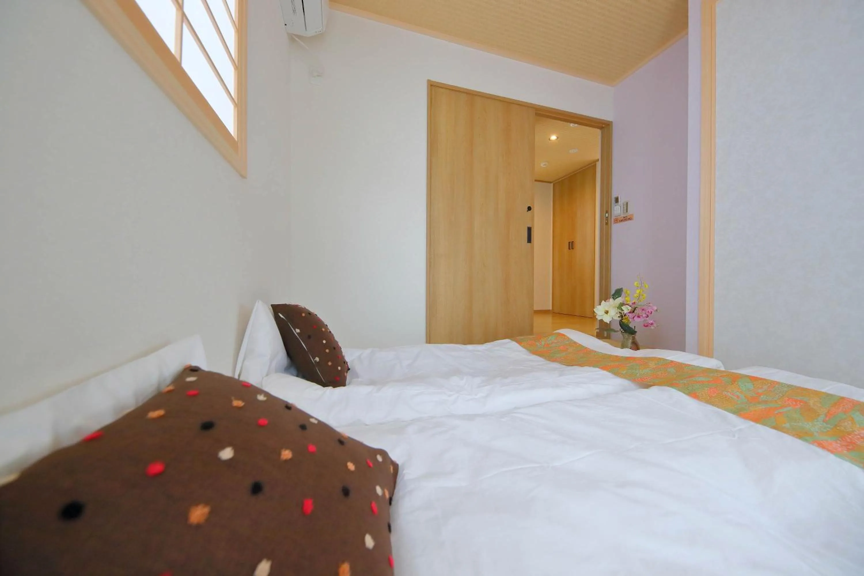 Bed in Kyo Machiya Ryokan Yuan