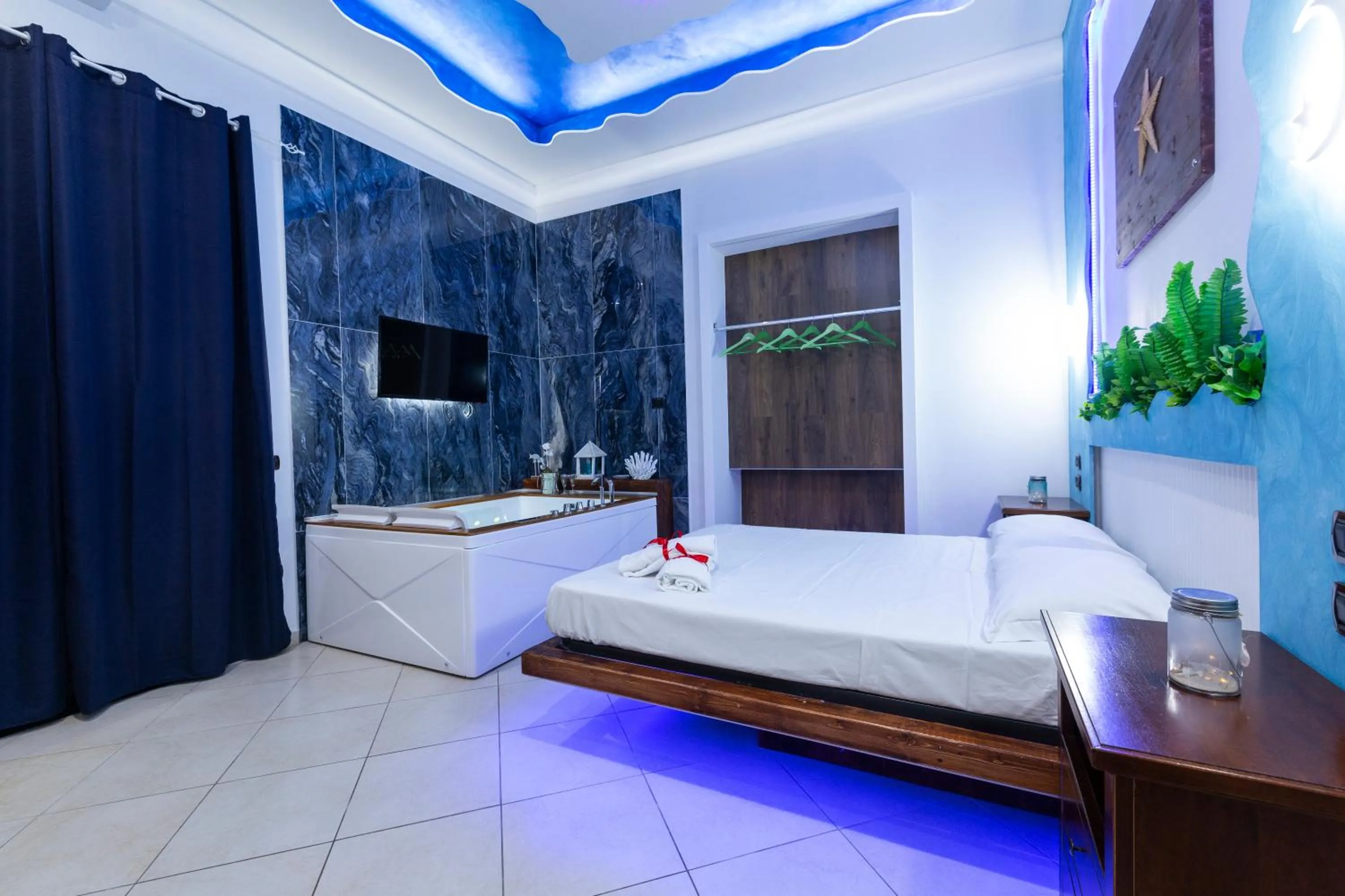 Bed in Pompei Luxury Rooms