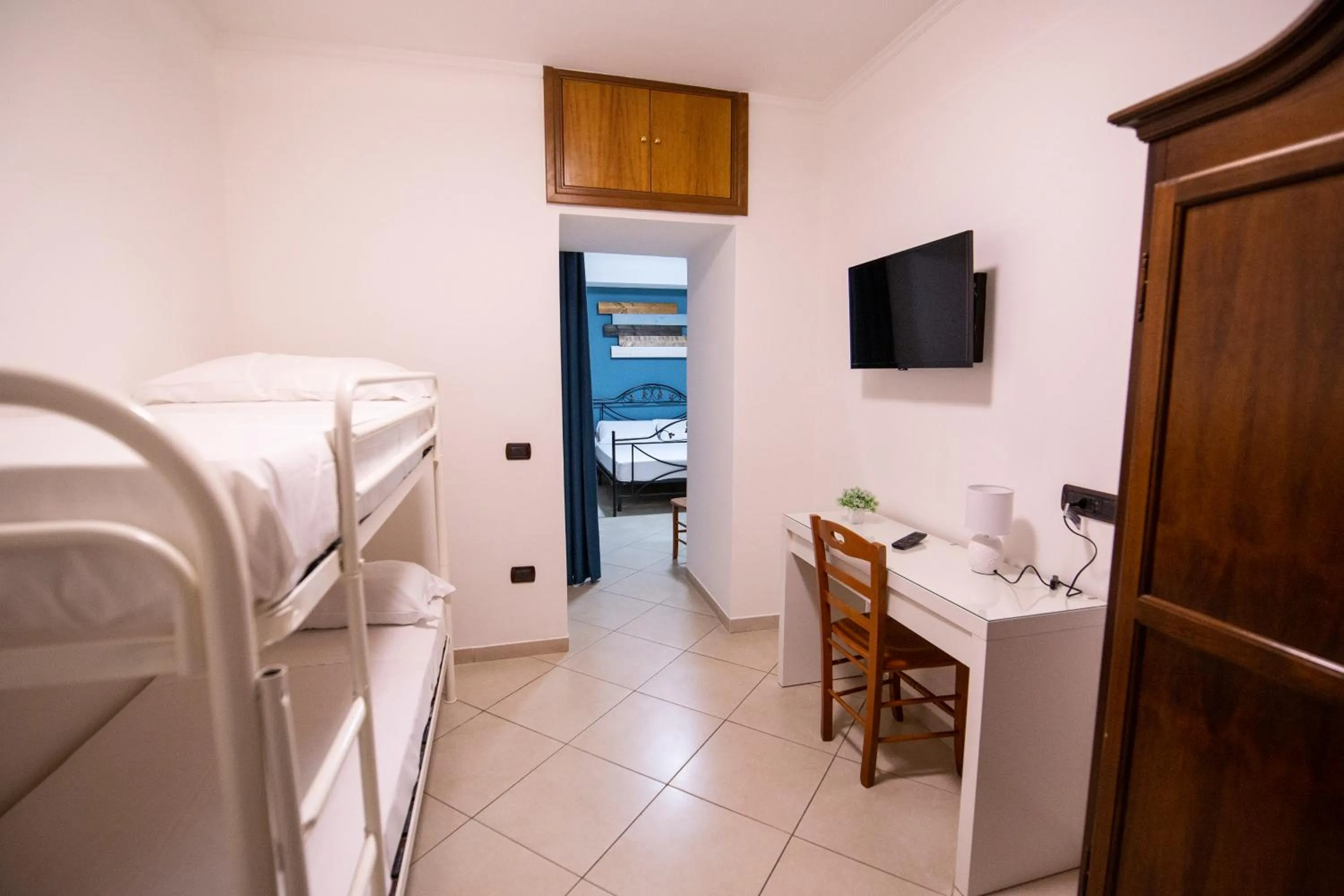 Bed in Pompei Luxury Rooms