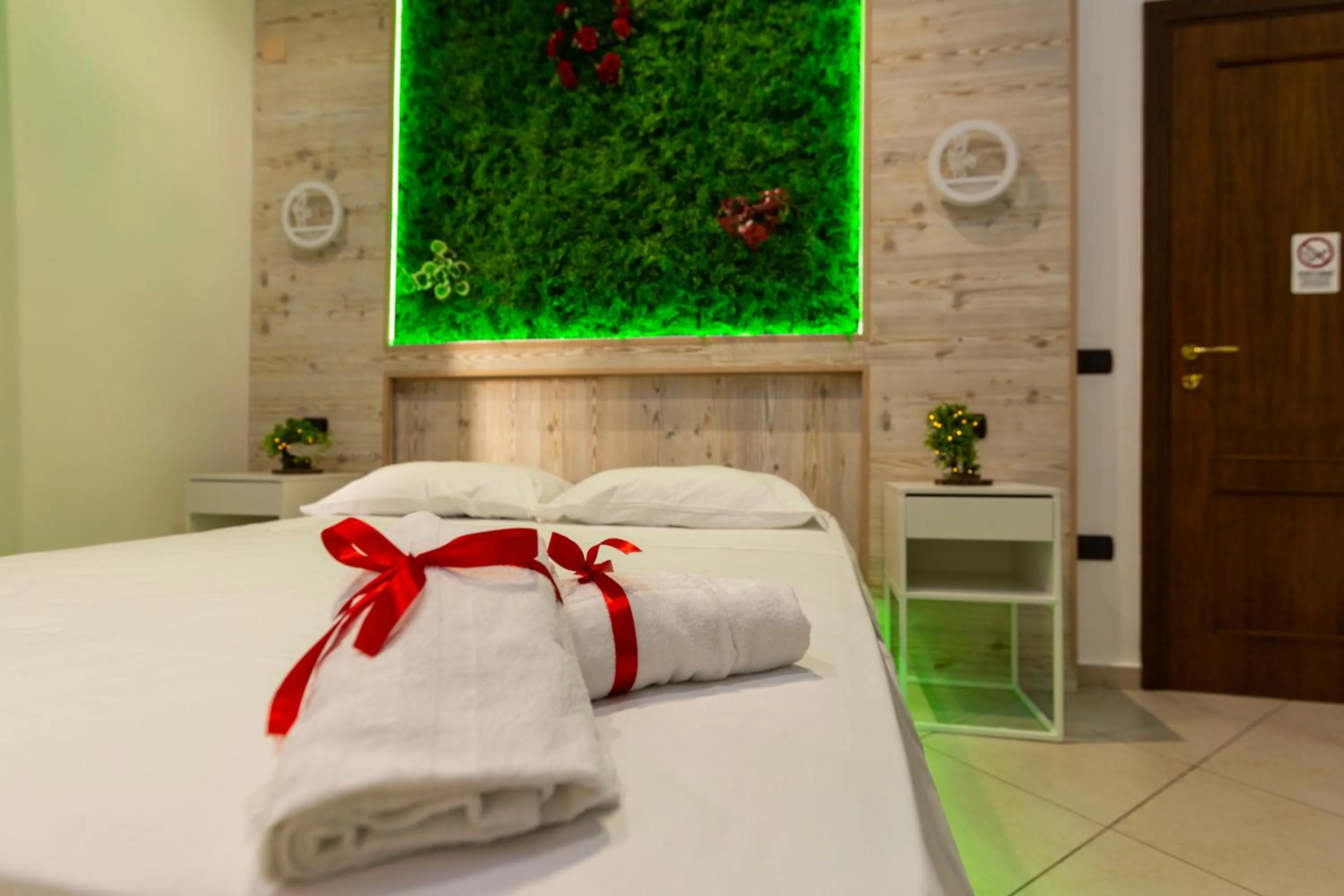 Bed in Pompei Luxury Rooms