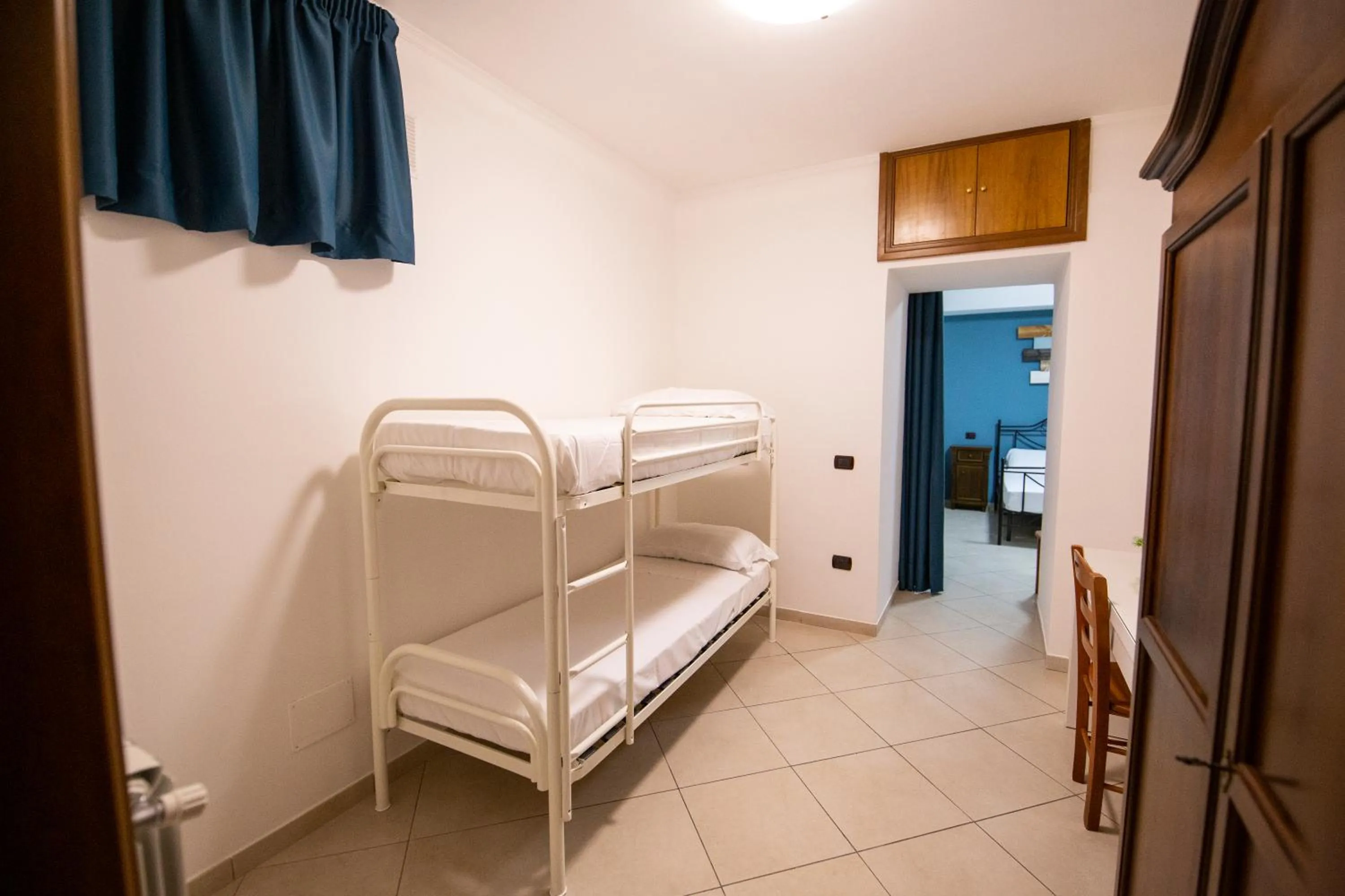Bed in Pompei Luxury Rooms