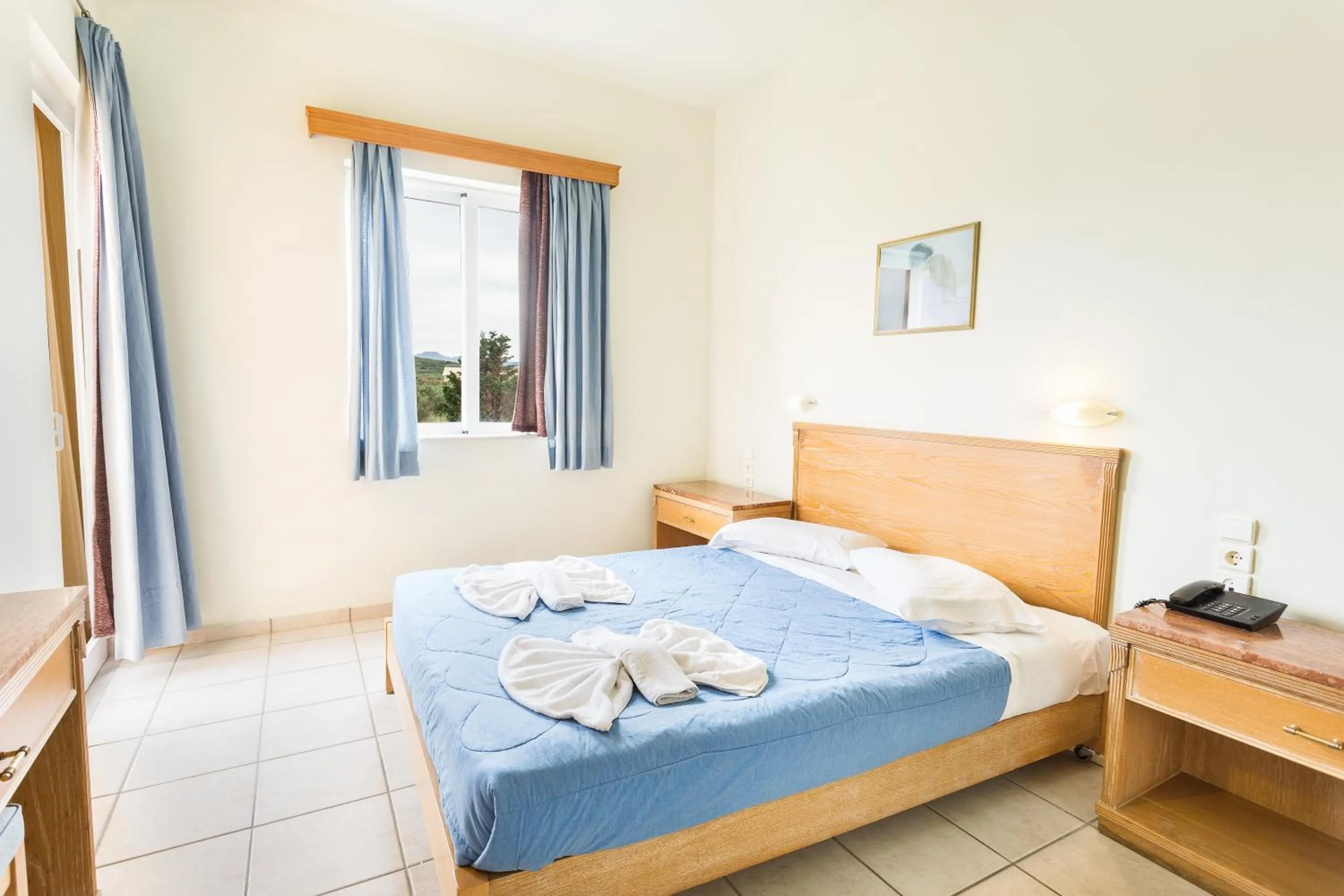 Bed in Alonia Hotel Apartments