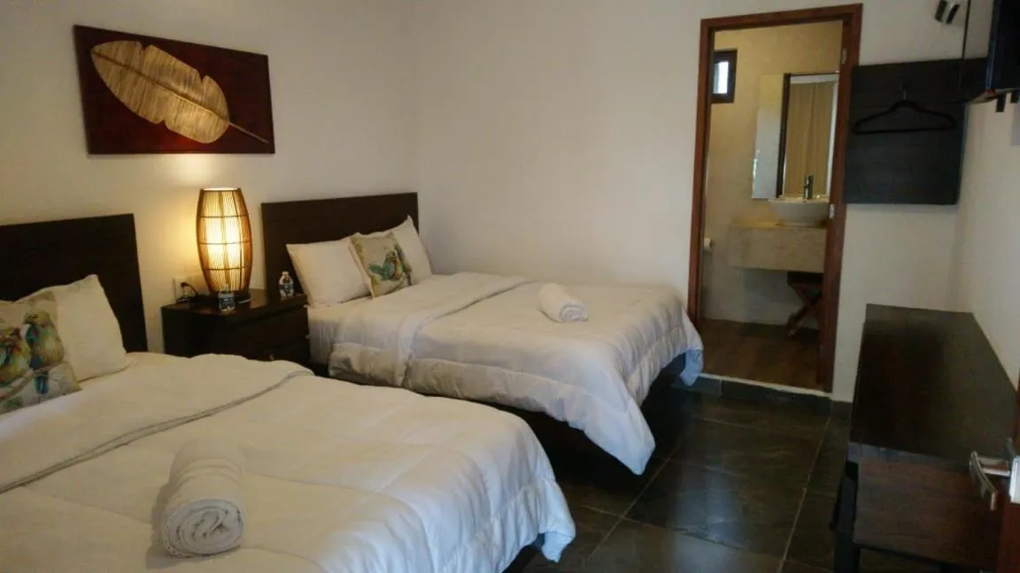 Bed in Hotel Sun Ha Bacalar