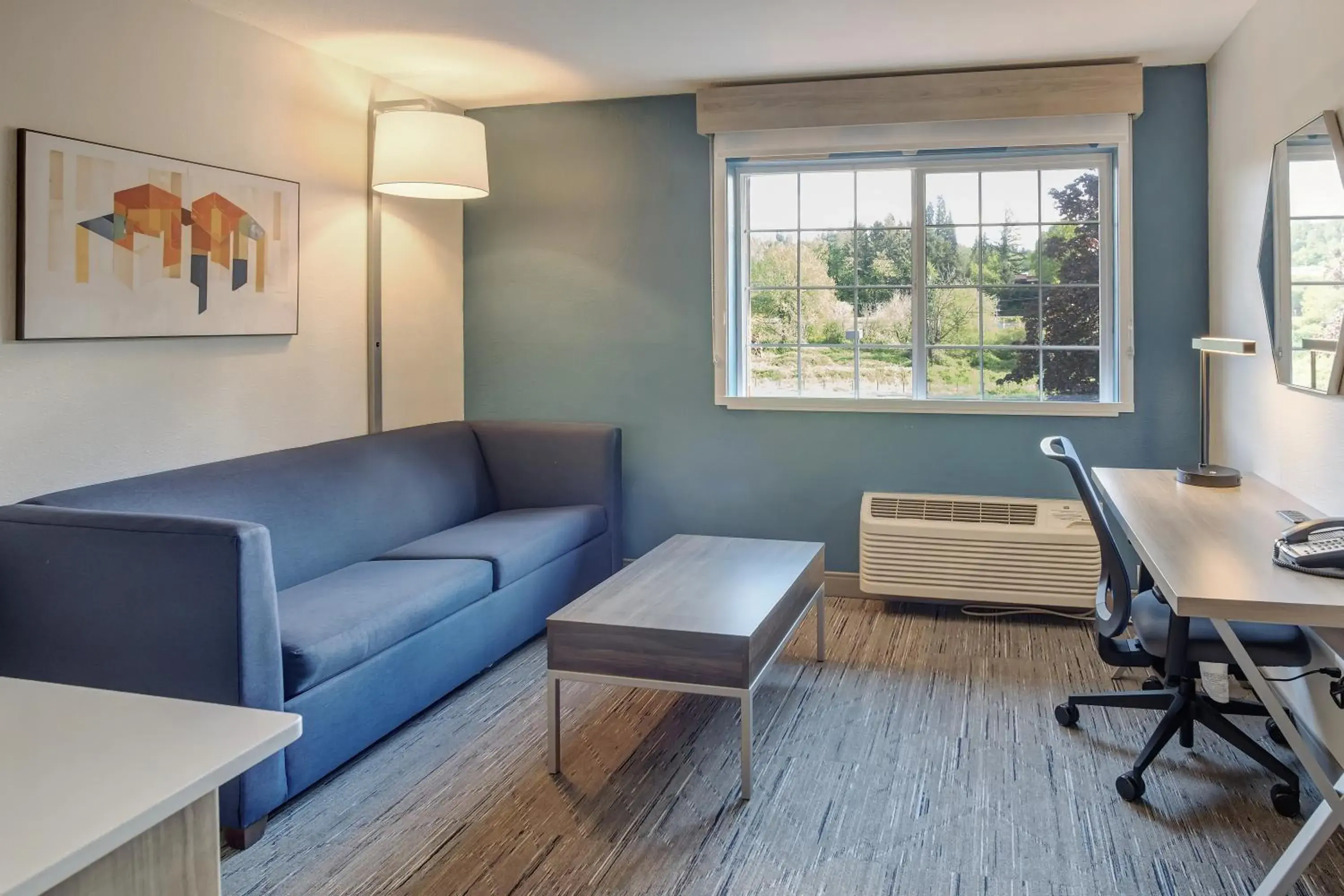 Living room in Holiday Inn Express Portland East - Columbia Gorge by IHG Living room in Holiday Inn Express Portland East - Columbia Gorge by IHG