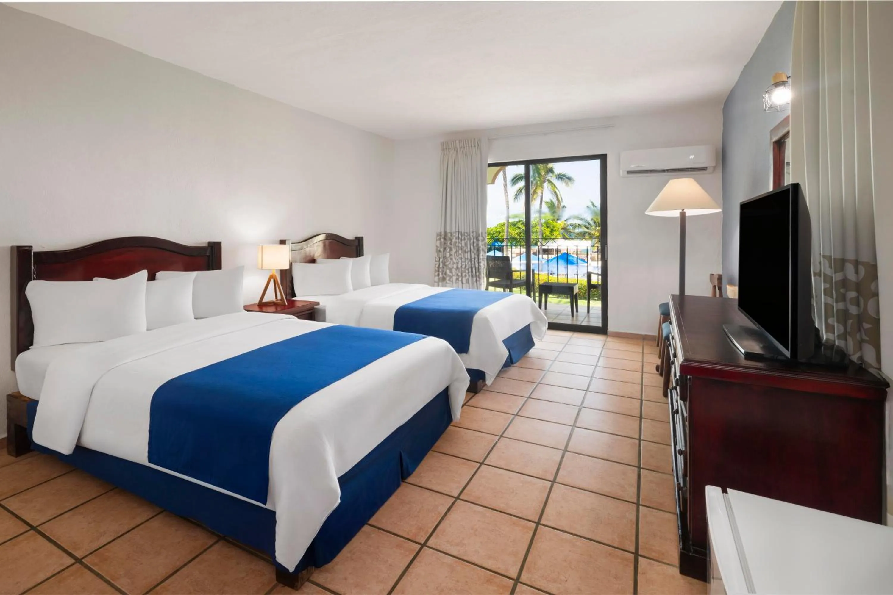 Bed in Grand Decameron Complex Bucerias, A Trademark All-Inclusive Resort