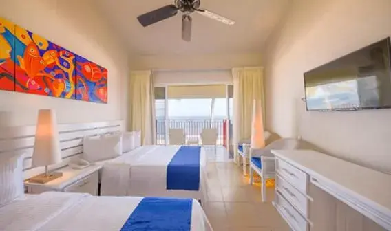 Bed in Grand Decameron Complex Bucerias, A Trademark All-Inclusive Resort Bed in Grand Decameron Complex Bucerias, A Trademark All-Inclusive Resort