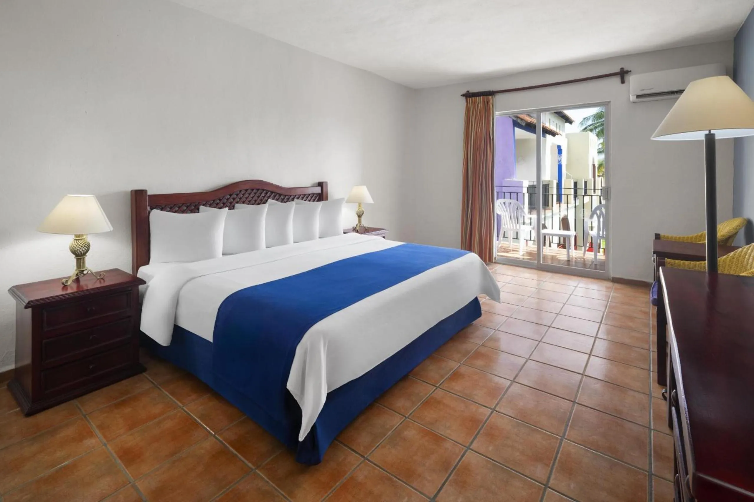 Bed in Grand Decameron Complex Bucerias, A Trademark All-Inclusive Resort