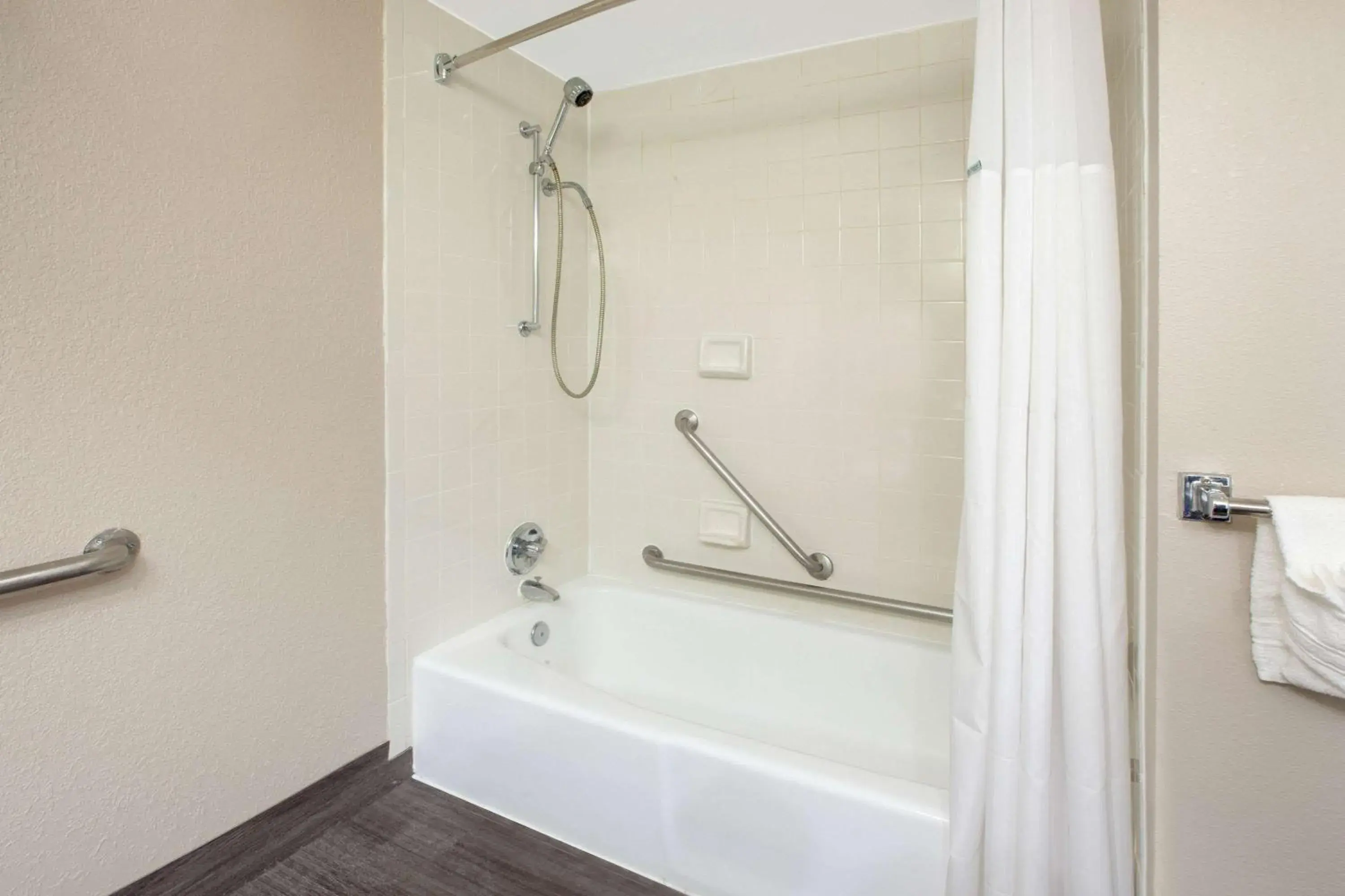 Bathroom in Baymont by Wyndham Grand Rapids Near Downtown