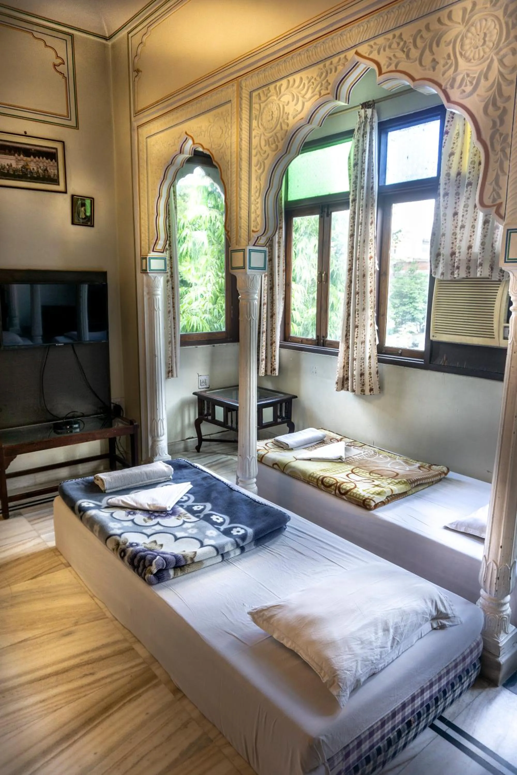 Bed in Krishna Palace - A Heritage Boutique Hotel