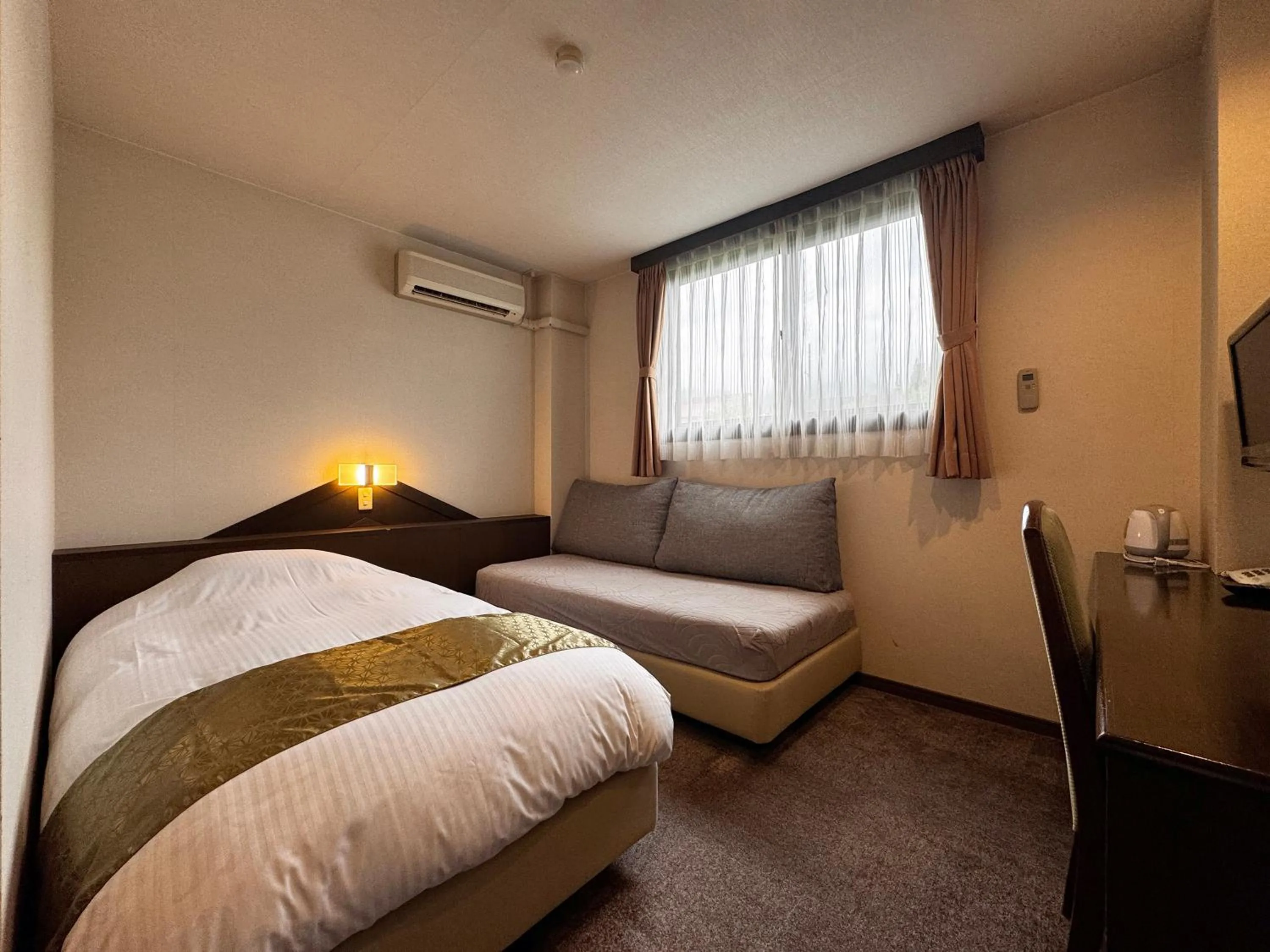 Bed in Hotel Cerulean Alpine