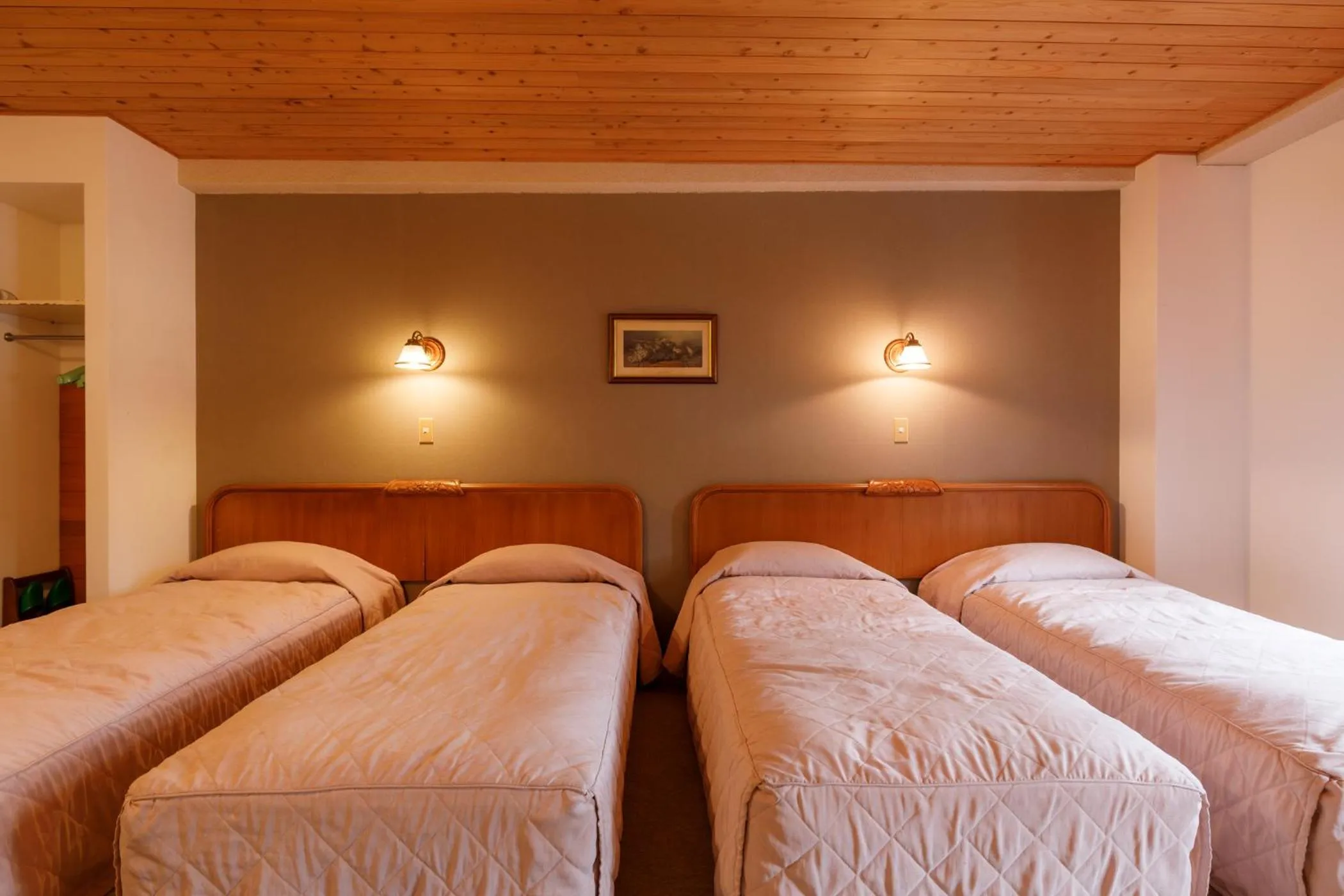 Bed in ホテルけやきの樹