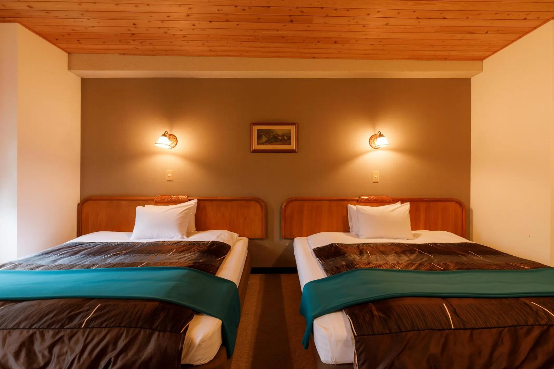 Bed in ホテルけやきの樹